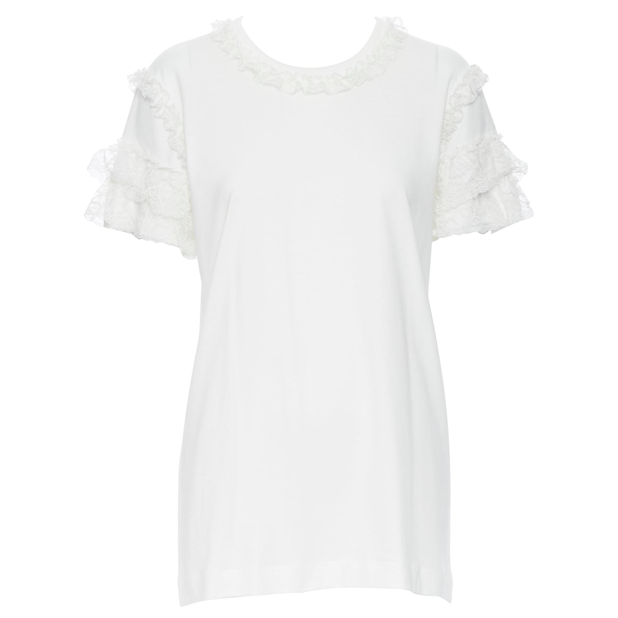 DOLCE GABBANA white cotton floral lace ruffle short sleeve t-shirt top IT40
Brand: Dolce Gabanna
Model Name / Style: Lace polo
Material: Cotton blend
Color: White
Pattern: Solid
Extra Detail: Lace ruffle trimming at neckline and sleeves.
Made in: