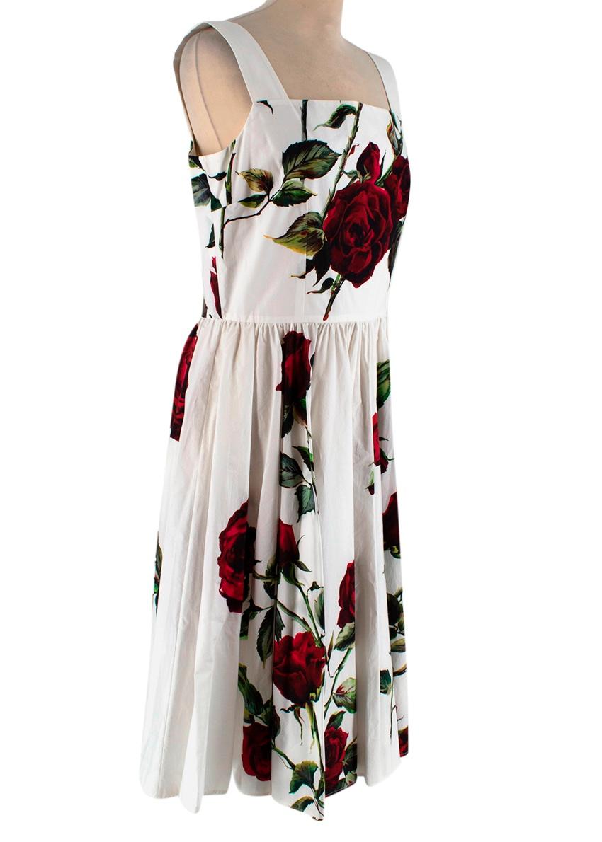 Dolce & Gabbana White Cotton Floral Print Dress

Dolce & Gabbana's cotton-poplin sundress is inspired by the florals of the design duo's native Italy. Printed with roses, this piece has a flattering '50s-style silhouette, it cinches at the waist and