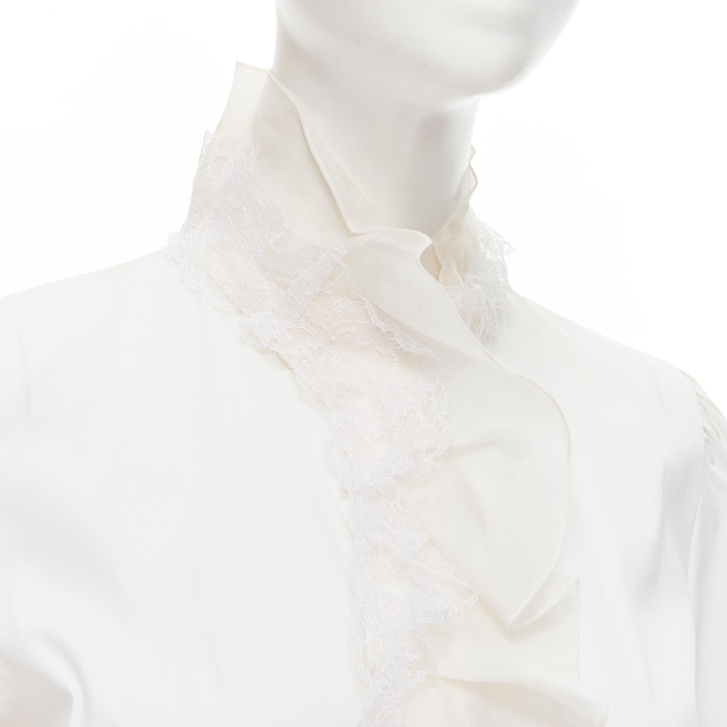 DOLCE GABBANA white cotton lace ruffle collar puff sleeve shirt IT44 M 
Reference: GIYG/A00206 
Brand: Dolce Gabbana 
Material: Cotton 
Color: White 
Pattern: Solid 
Closure: Button
Extra Detail: Lace trim silk ruffle collar. Long sleeve shirt. Fit