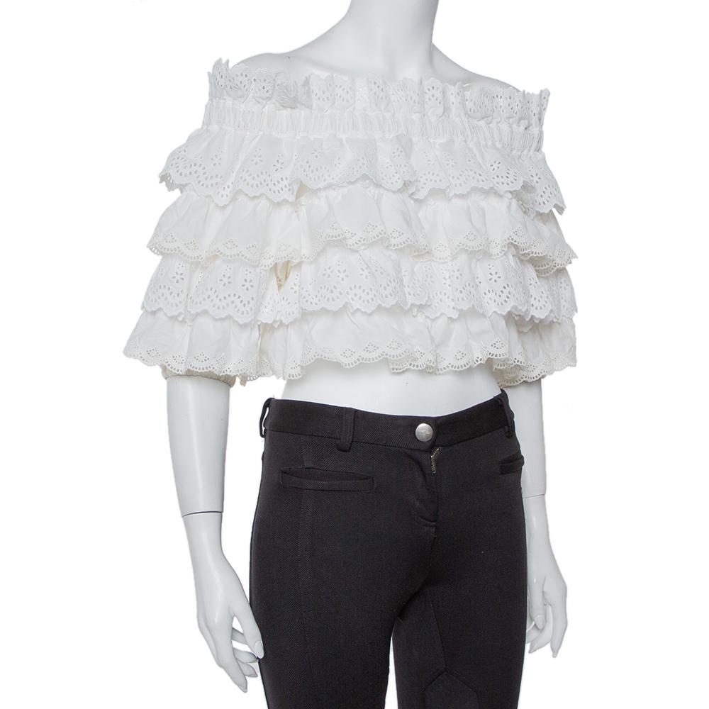 Style yourself by wearing this outstanding crop top from Dolce & Gabbana on your casual day out. This white crochet top is cut from silk. Complete with an off-shoulder style, the top will look best with a pencil skirt and block heel pumps.

