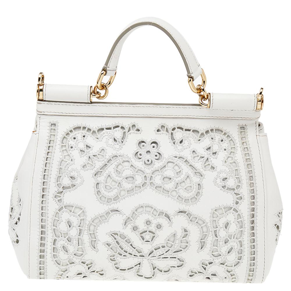 The iconic Miss Sicily bag by Dolce & Gabbana is one of the most loved designs from the brand. The elegant silhouette is made from floral leather in a white shade and features a front flap accented with the logo plaque. The creation is complemented