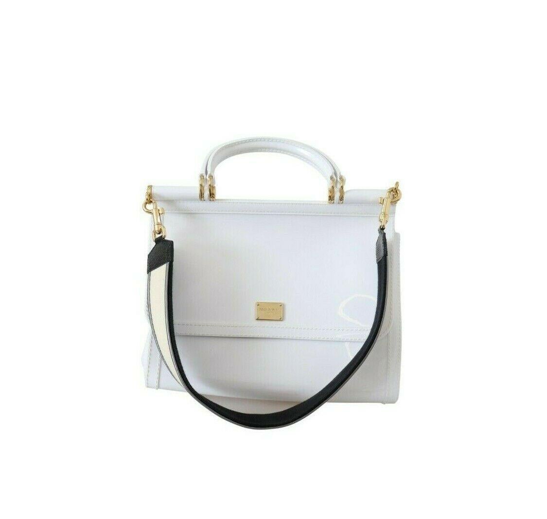 Absolutely stunning, 100% Authentic, brand new with tags Dolce & Gabbana SICILY PVC shoulder bag with logo plaque and gold metal detailing featuring a detachable strap, handle strap and magnetic flap closure.

Model: Sicily Bag

Color: White with