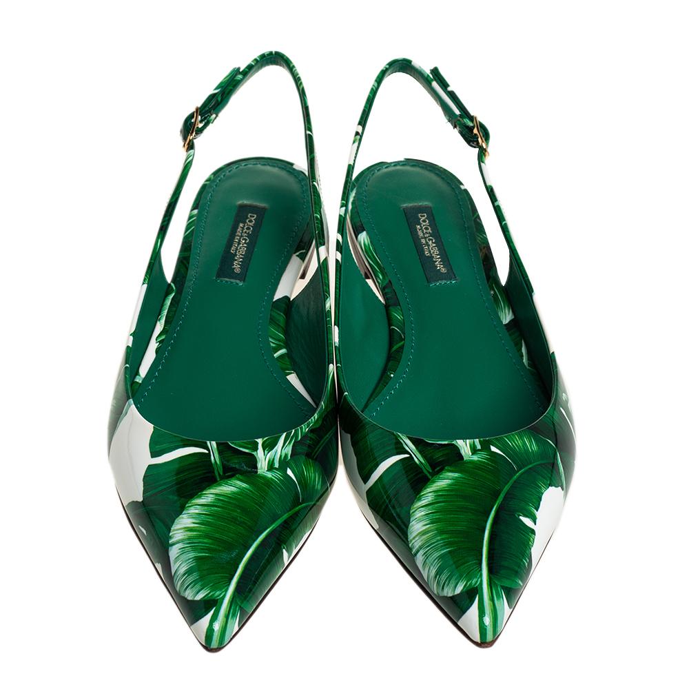 Wearing these Dolce & Gabbana flats would be like wearing spring on your feet. We know the label's love for florals that is exemplified in these stunning slingbacks. Crafted from patent leather, they feature banana leaves printed all over them and