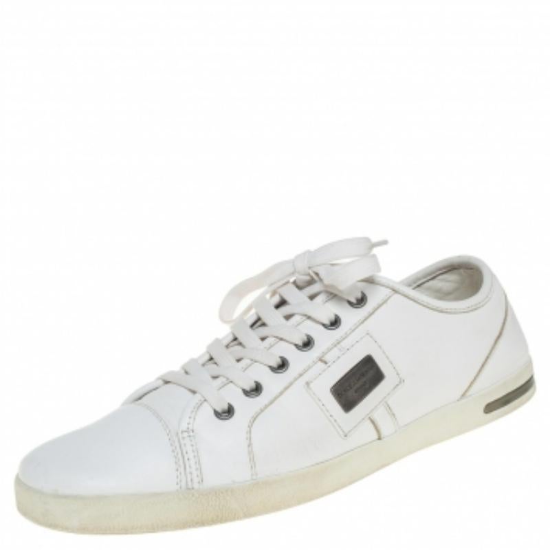 Built to last and add sophistication to any outfit, these leather sneakers by Dolce & Gabbana are all you need. The simple look makes these white sneakers look extremely stylish. They feature lace-up uppers and rubber soles.