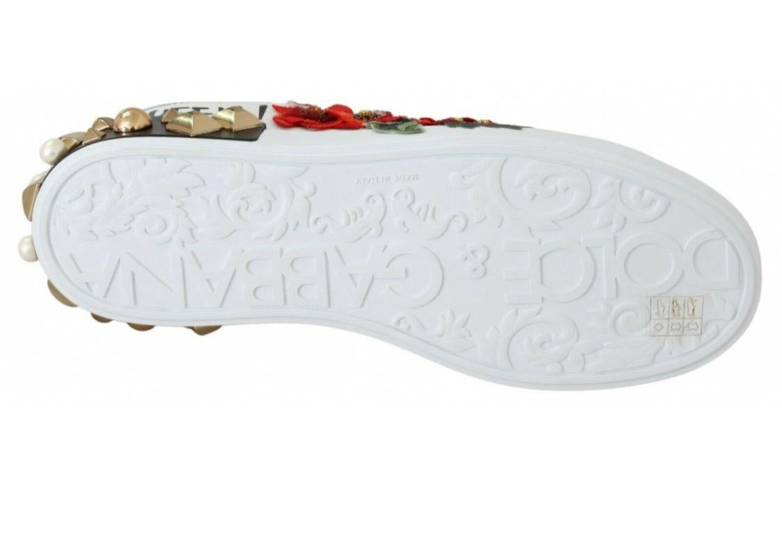 Gorgeous brand new with tags,
100% Authentic Dolce & Gabbana
White lace-up sneakers. Made of
leather. Adorned with colourful prints
with logo, silver-tone inserts and tactile
floral appliqué. They also feature white
rubber sole enhanced by