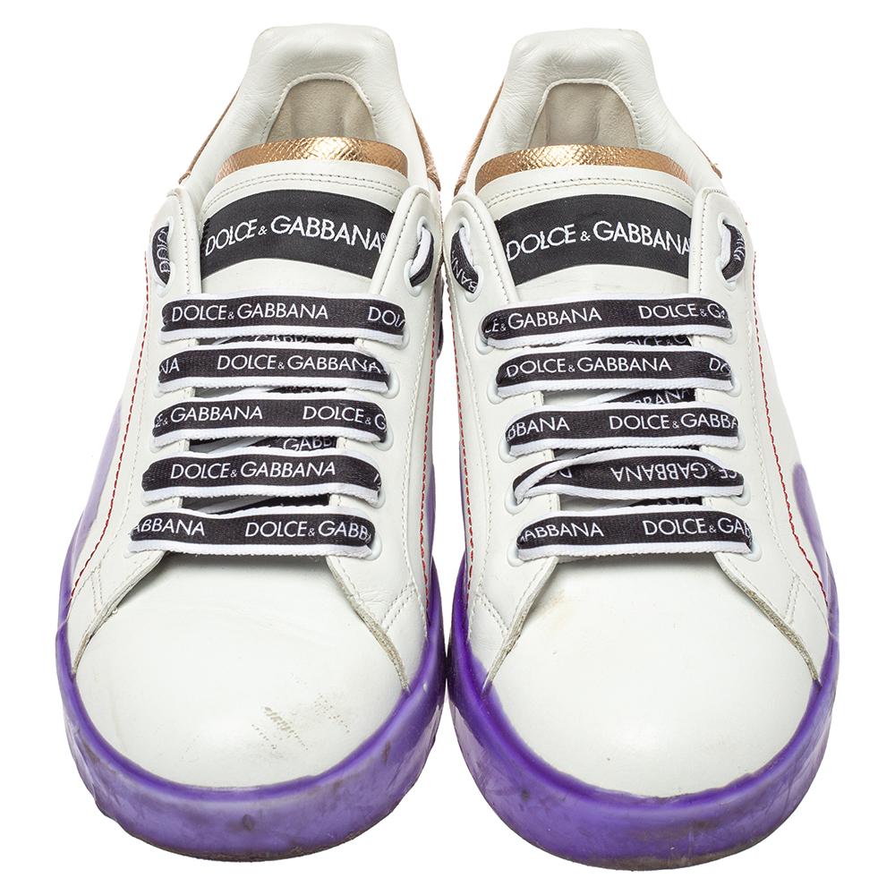 You're sure to win hearts with these Portofino Melt low-top sneakers from Dolce & Gabbana. Crafted from quality leather, the trendy shoes carry round toes, brand label lace-ups on the vamps, and logo details at the rear. Endowed with leather-lined