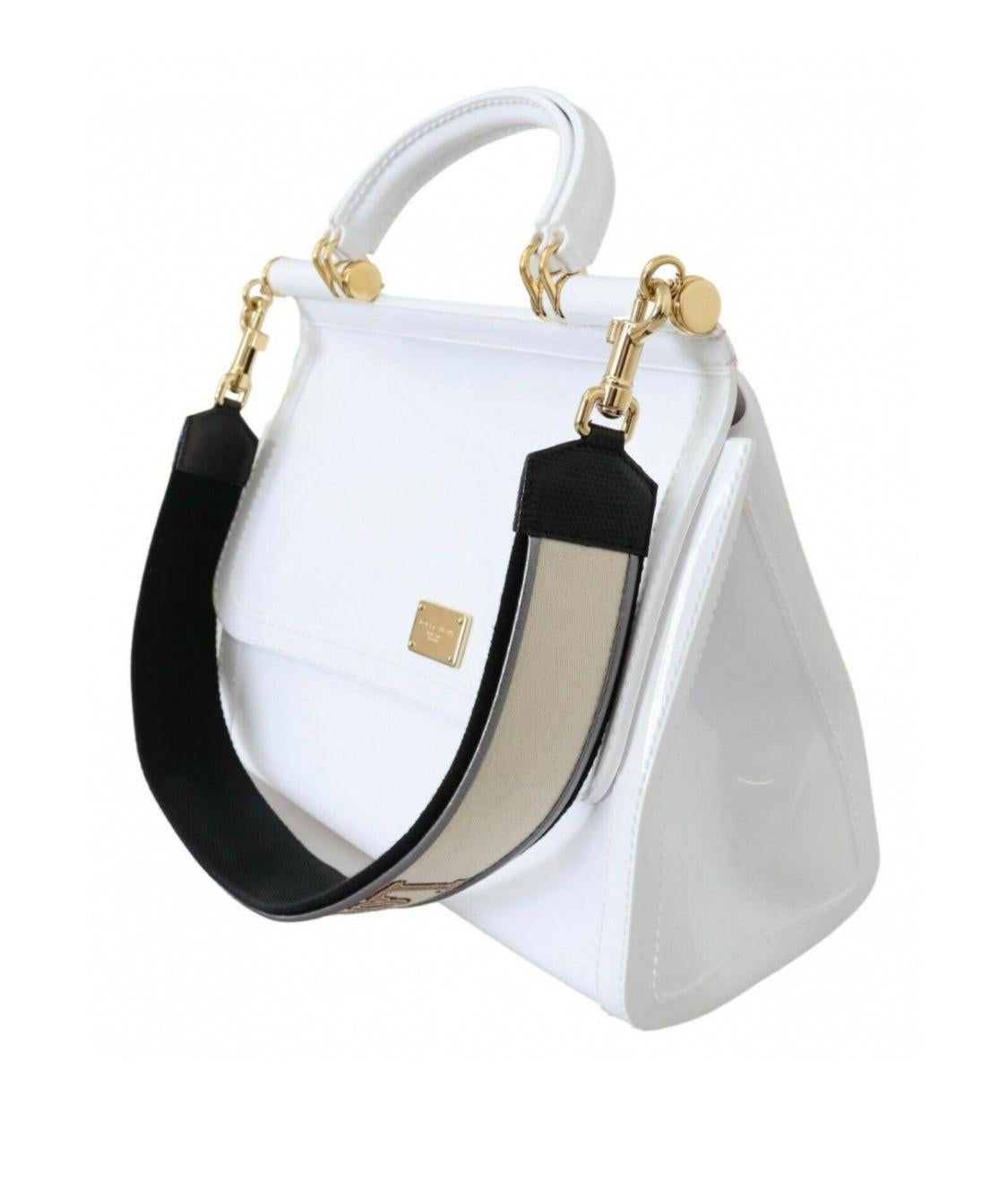 Absolutely stunning, 100%
Authentic, brand new with tags Dolce
& Gabbana SICILY PVC shoulder bag
with logo plaque and gold metal
detailing featuring a detachable strap,
handle strap and magnetic flap closure.
Model: Sicily Bag

Color: White with