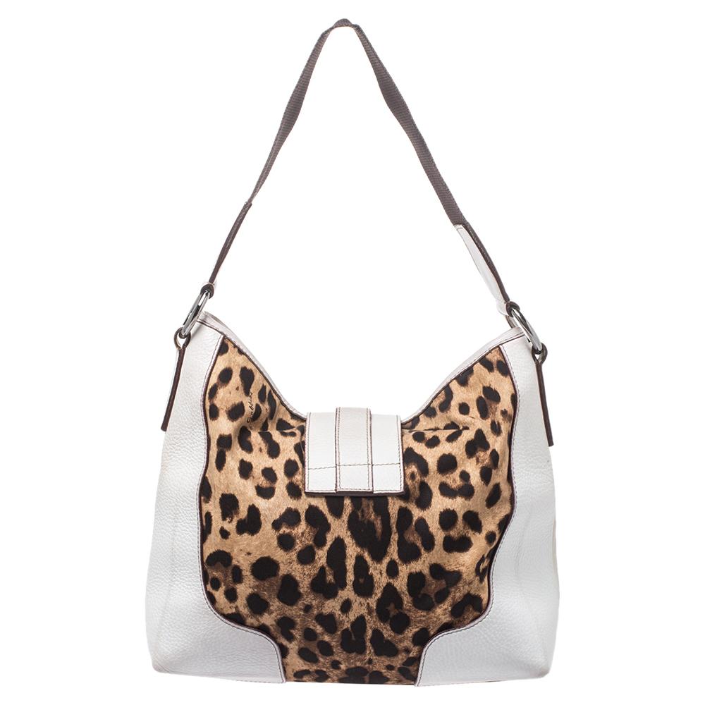 For all the Dolce & Gabbana fans out there, your search for that perfect handbag ends here. Carry this stylish hobo bag by the iconic brand wherever you go and get set to win praises. This eye-catching flap bag comes in a charming white hue, leopard