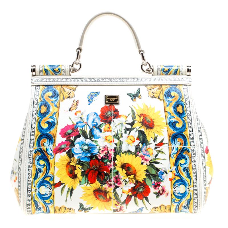 The Miss Sicily tote is one of the most celebrated creations from Dolce and Gabbana. The tote beautifully embodies the spirit of extravagance and feminity that the Italian luxury brand carries. Crafted from leather, the bag features a multicolored