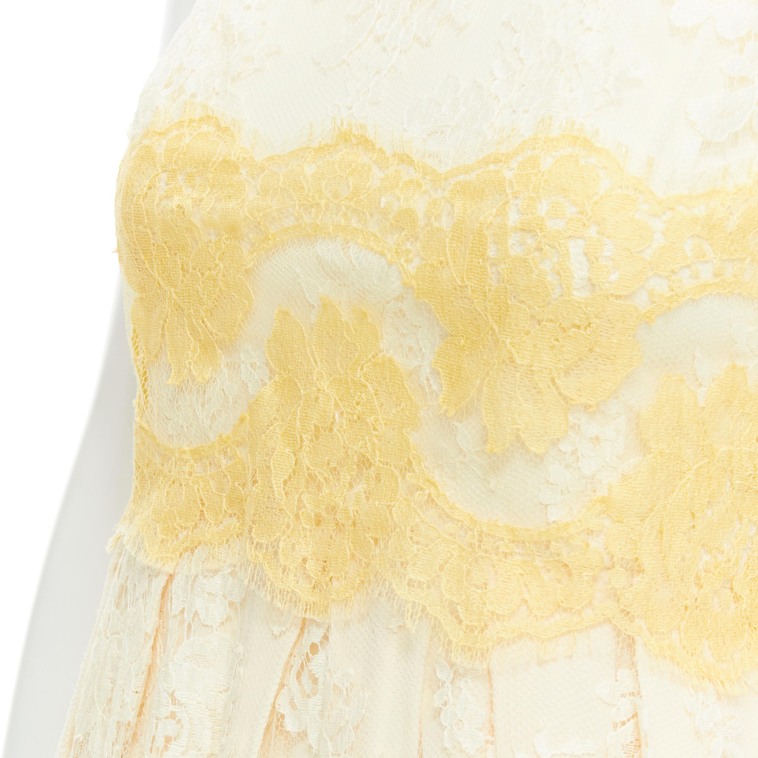 DOLCE GABBANA white pastel yellow pink lace fit flared cocktail dress IT36 XS 
Reference: TGAS/B02033 
Brand: Dolce Gabbana 
Material: Lace 
Color: White 
Pattern: Floral 
Closure: Zip 
Made in: Italy 

CONDITION: 
Condition: Very good, this item