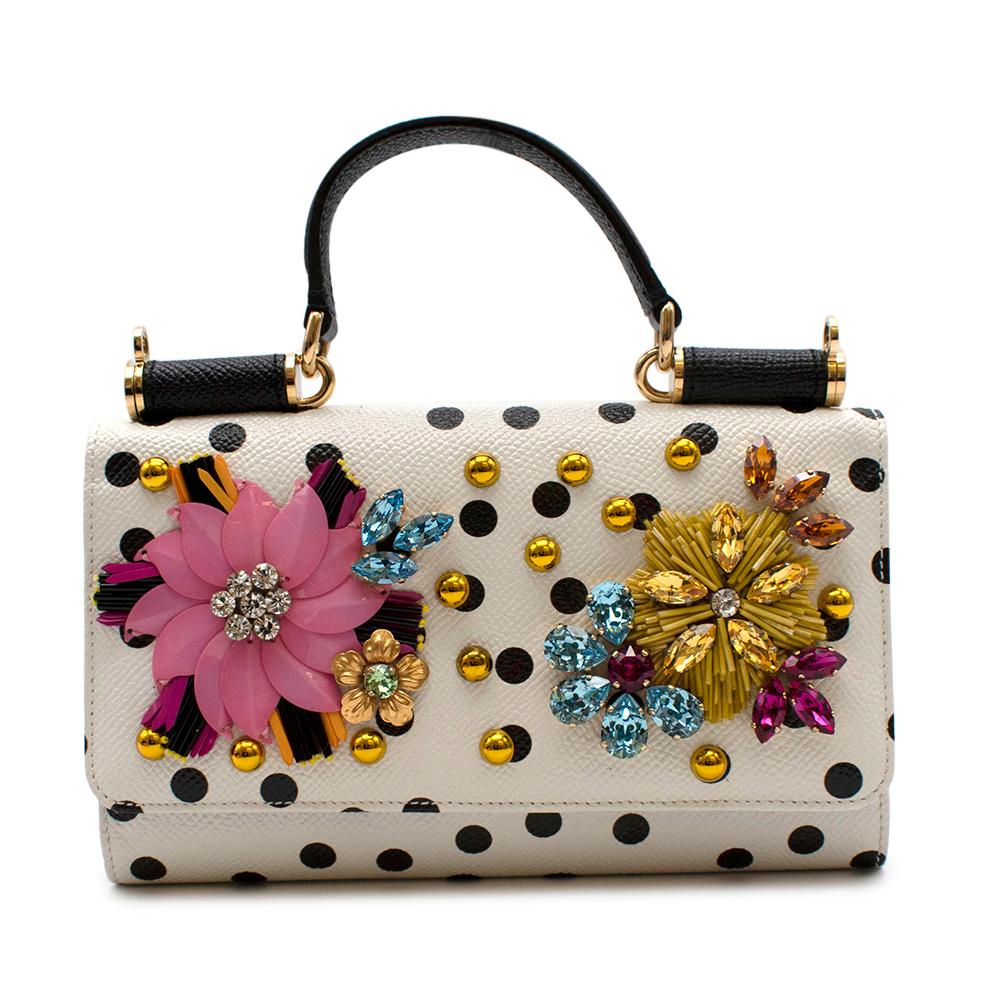 Dolce & Gabbana White Polka Dot Embellished Leather Wallet on Chain

-Luxurious leather material
-Gorgeous floral and dot embellishments
-Top handle
-Gold-toned hardware
-Magnetic snap-flap closure
-One inside phone pocket
-Seven inside credit card