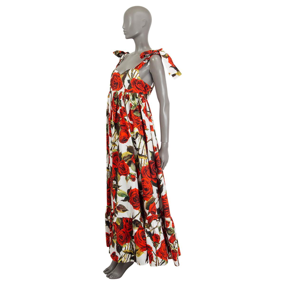 100% authentic Dolce & Gabbana rose print maxi dress in red, green and white cotton (100%). Features self-tie ribbon sleeves. Opens with a concealed zipper and a hook at the back. Unlined. Has white stitches at the front bustier and some stains on