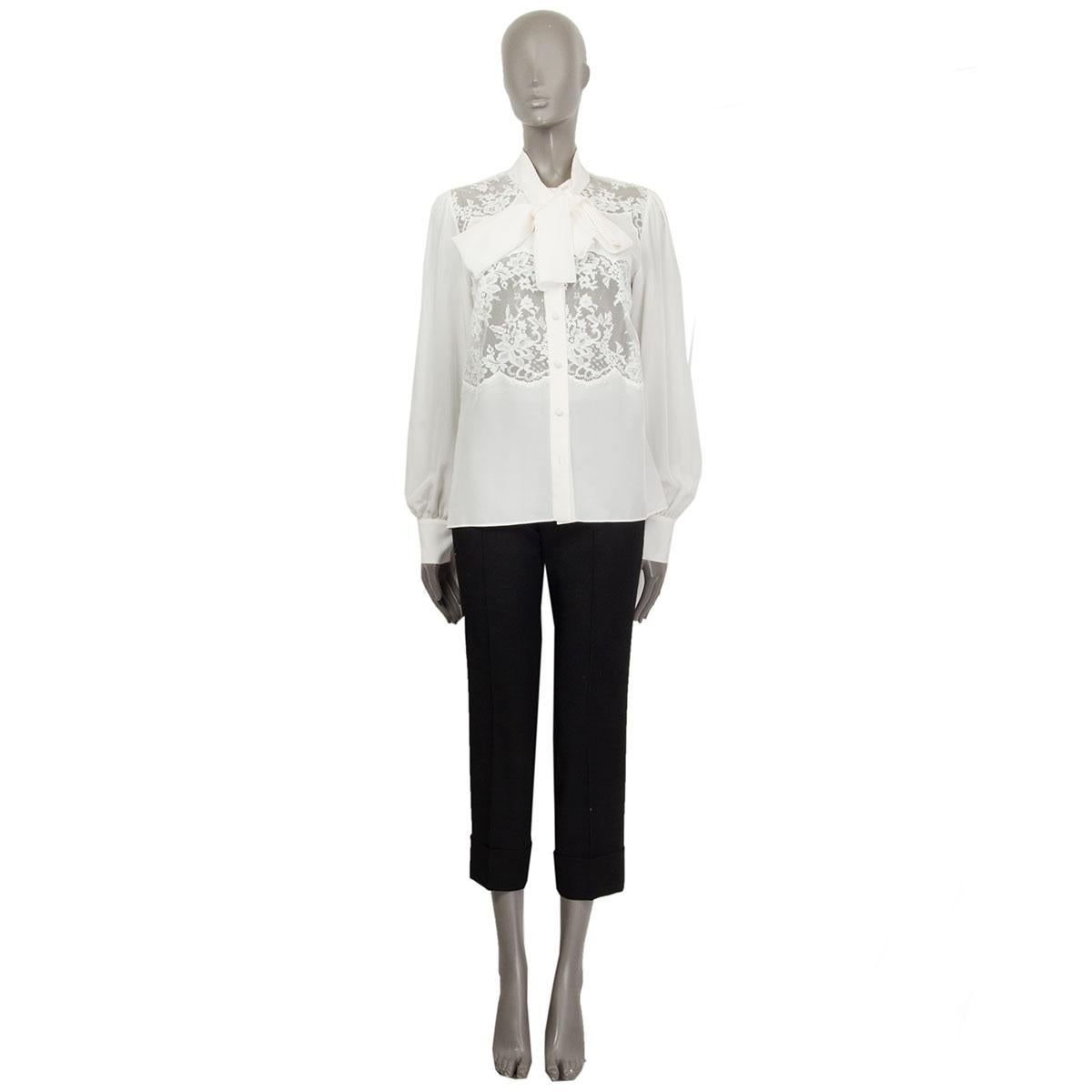 100% authentic Dolce & Gabbana pussy-bow blouse in off-white silk (90%), cotton (7%) and nylon (3%) featuring shoulder and front lace panels.   Has been worn and is in excellent condition. 

Measurements
Tag Size	42
Size	M
Shoulder Width	38cm
