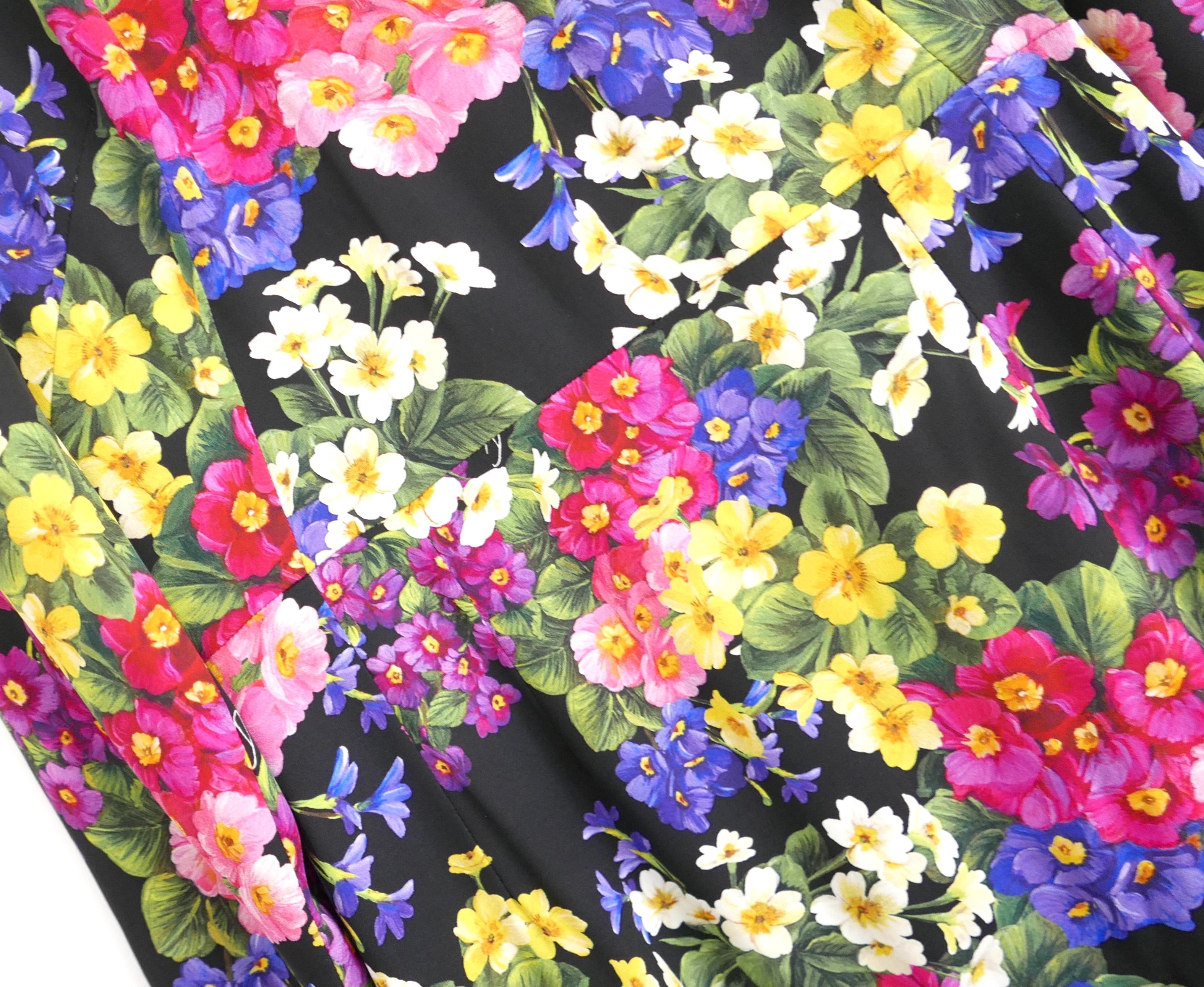 Gorgeous, ultra feminine Dolce & Gabbana rose print print sheath dress. Bought for £2175 and worn twice. Has been dry cleaned. Made from smooth black viscose crepe with a delicate wild rose print. It has Dolce’s a semi tailored sheath cut with midi