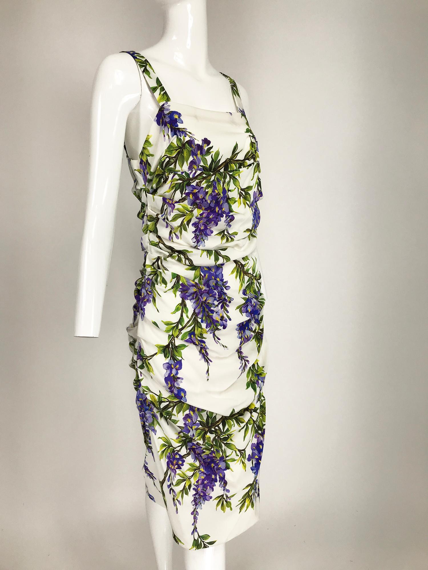 Dolce & Gabbana wisteria-print stretch silk blend crepe dress. Formfitting dress has a square low neckline at front and back, sleeveless with wide shoulder straps. The ruched side seams create a draped bodice and skirt, nips at the natural waist.