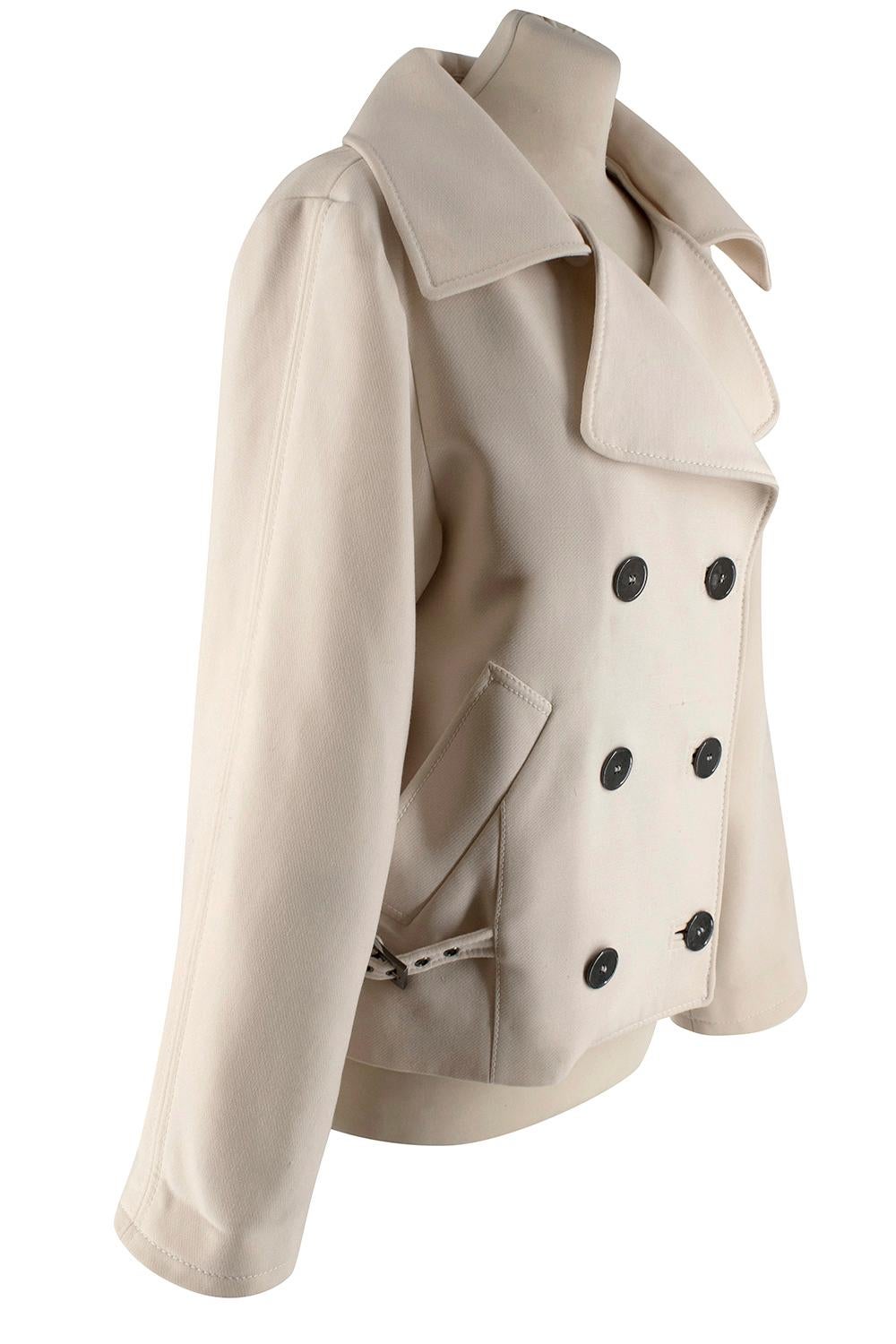 Dolce & Gabbana Women's Beige Jacket

- Double breasted Jacket
- Soft touch light beige fabric 
- Dark, metalic button fastening, including inside buttons 
- Two side pockets
- Dolce & Gabbana print silk lining 
- Wide Collar 
- Detachable panel on