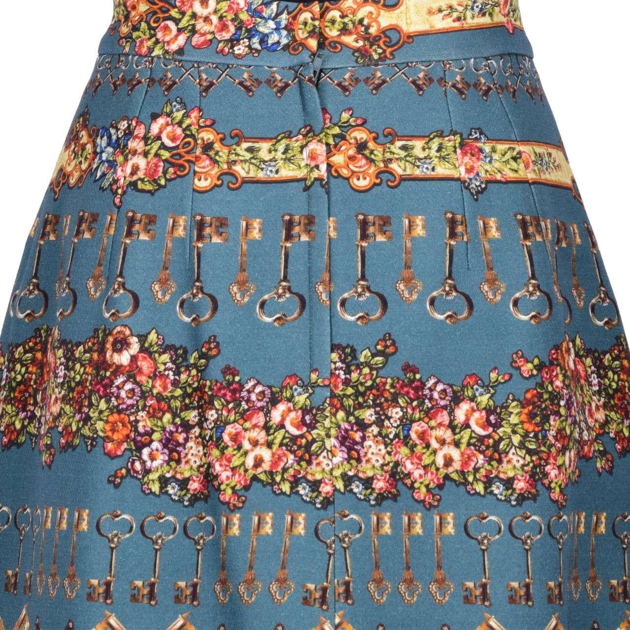 - Wool and Silk skirt with gold keys and flowers print by DOLCE & GABBANA Black Label - New with Tag - Material: 72% Wool, 28% Silk - Lining: 96% Silk, 4% Elastan - Gold and silver keys print - Zip and push button fastening - MADE IN ITALY - Model: