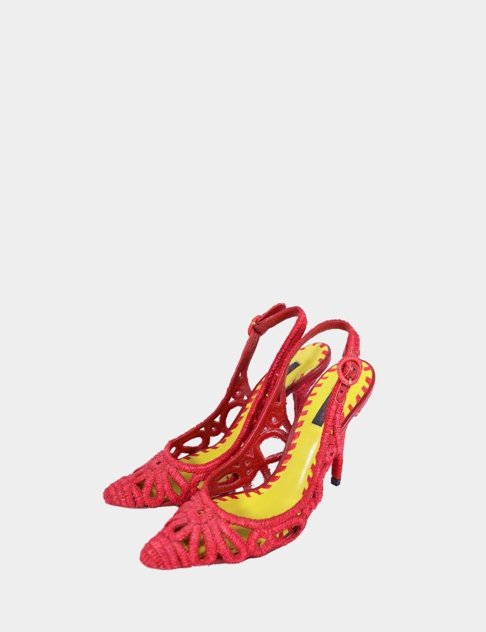 Add a fiery Italian flair to your shoe collection with these Dolce & Gabbana red woven slingback heels. Featuring a striking cutout crochet-style design, these pointed-toe heels are both sultry and sophisticated. The vibrant red upper is delicately