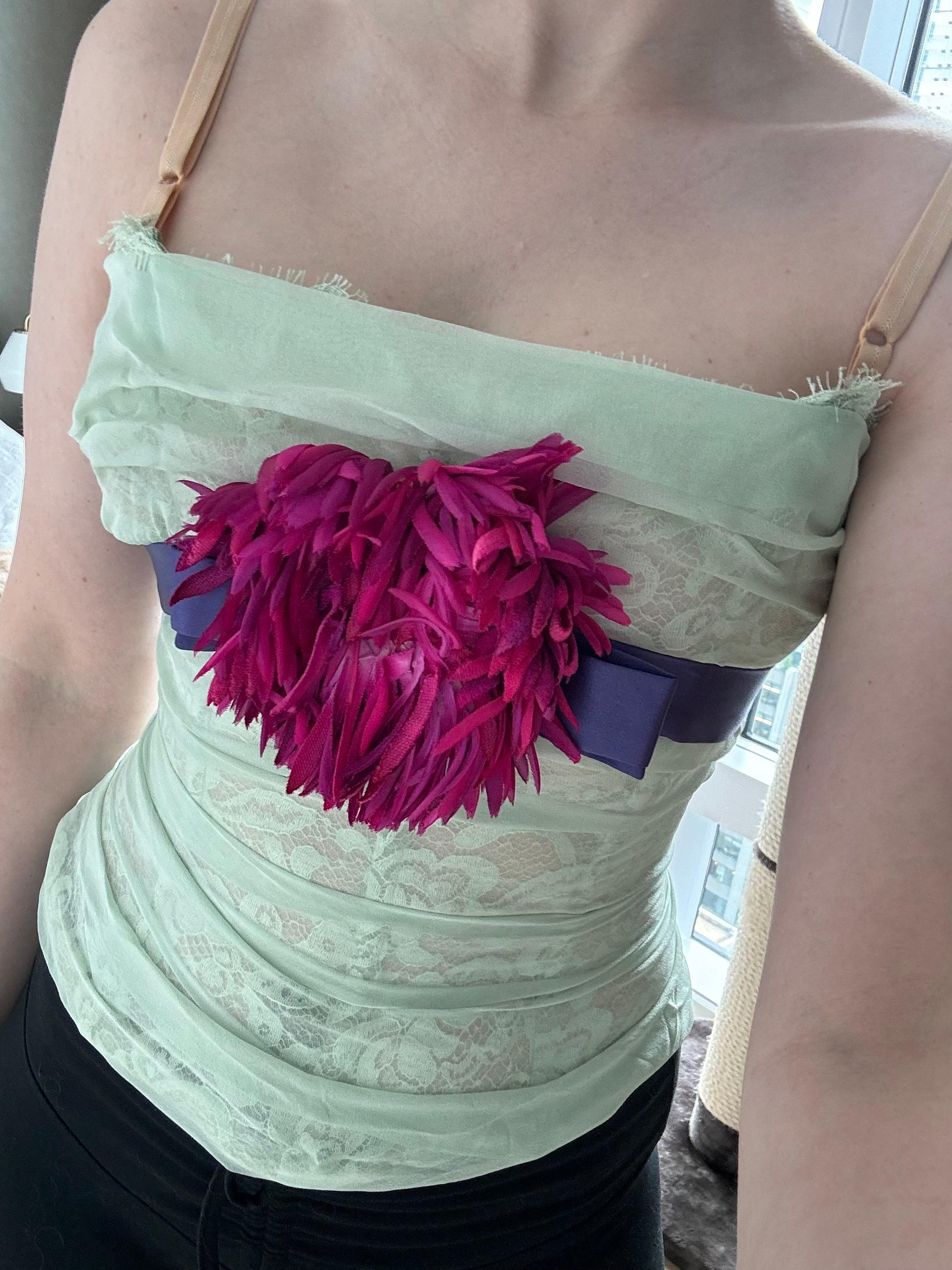 Dolce & Gabbana
Circa 2005
Mint green, fuchsia, and purple
NWT’s, flawless with the exception of color transfer on the back as pictured
IT46
Fits like an IT44
Entire garment is 28” in width and 15” in length

Notes: ruched, 9 pieces of hard boning,