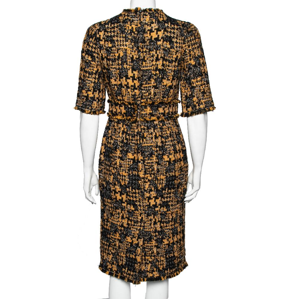 You'll find this dress super easy to style. It can be transformed with a jacket, a striking belt, and glamorous jewellery. The Dolce & Gabbana dress brings a classic silhouette. It has a fitted waist, short sleeves, and a knee-length hemline.

