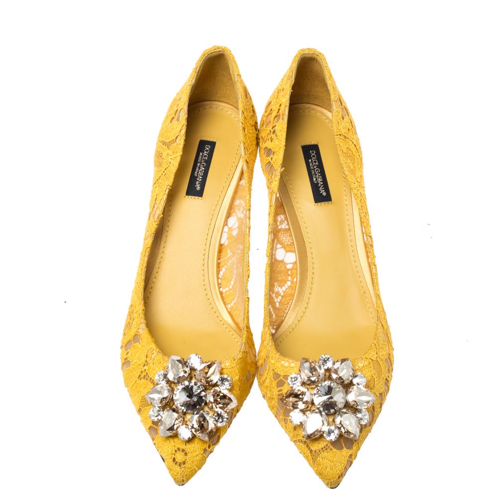 Deliver the most unforgettable looks in these yellow pumps from Dolce & Gabbana! From their shape and detailing to their overall appeal, they are utterly mesmerizing. The pumps are crafted from lace and decorated with crystals on their pointed toe