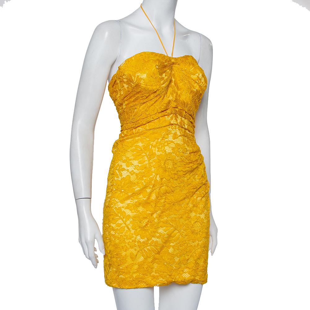 You're all set to dazzle with this dress from Dolce & Gabbana. Featuring a feminine lace body, the yellow dress carries a strapless style with a back zipper. It'll look enchanting with a pair of strappy stilettoes and a metallic clutch.

