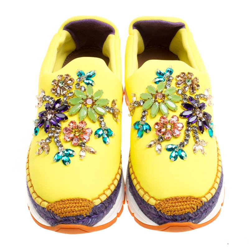 Fabulously designed to stand out and grab you compliments, these slip-on sneakers from Dolce & Gabbana deserve a special place in your wardrobe! Shining bright in yellow, these sneakers are crafted from neoprene and feature round toes, exquisitely
