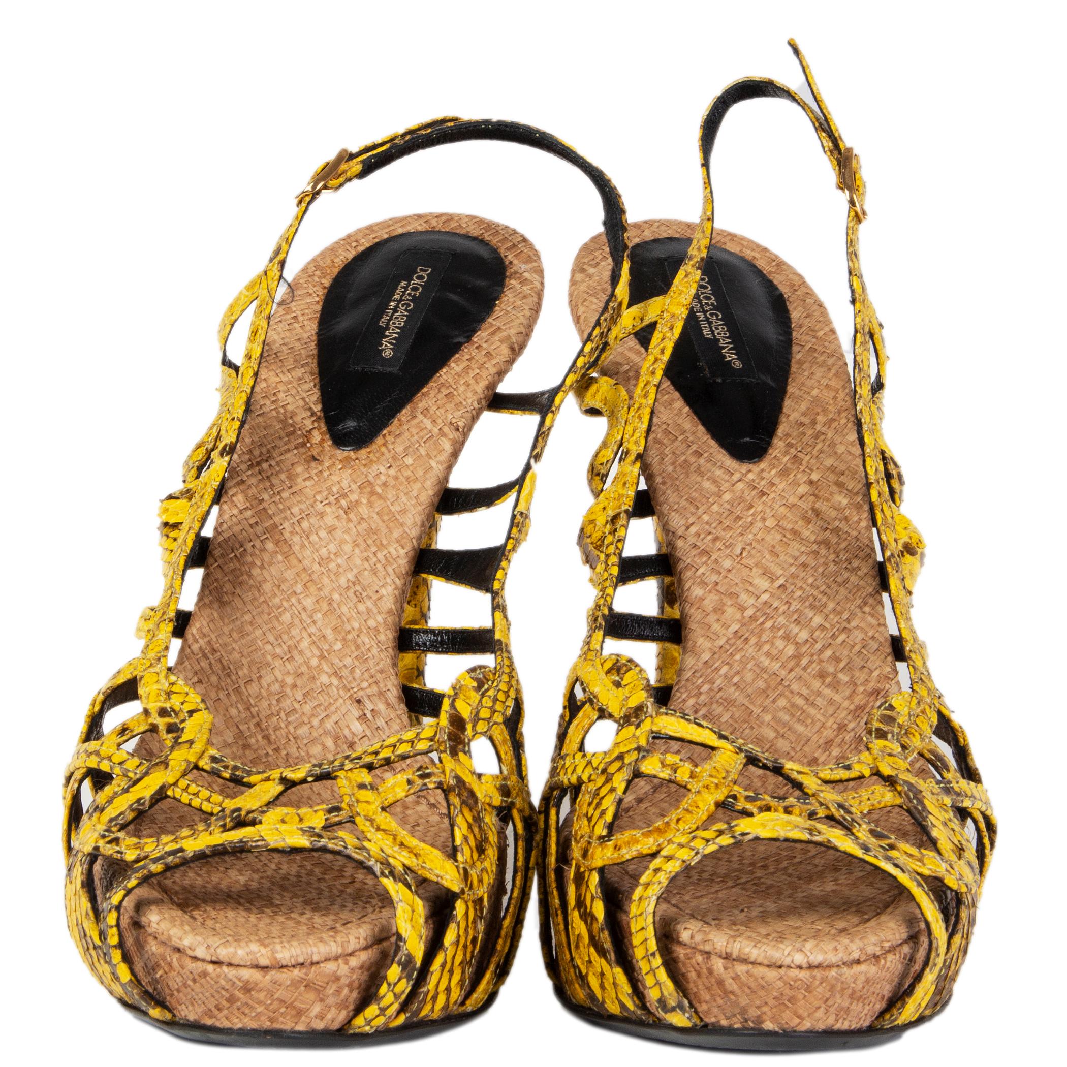 100% authentic Dolce & Gabbana strappy sandals in yellow dark brown snakeskin and woven raffia platform sole. Have been worn and are in excellent condition. 

Measurements
Imprinted Size	39.5
Shoe Size	39.5
Inside Sole	25.5cm (9.9in)
Width	7.5cm