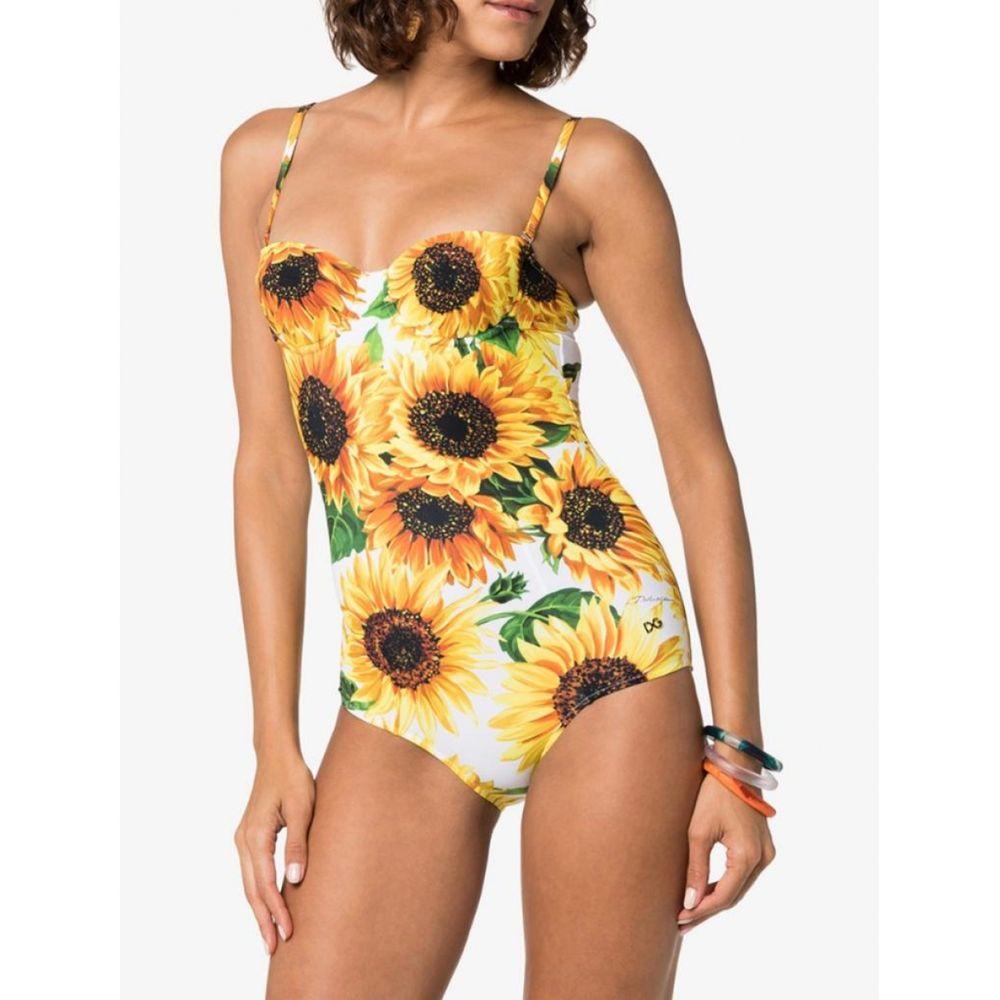 Dolce & Gabbana romantic full swimsuit with a built-in balcony bra made from precious fabric in the floral SUNFLOWER print has an extraordinarily sensual look. Perfect for both the poolside and as a top for a cocktail party:
-       
Underwired