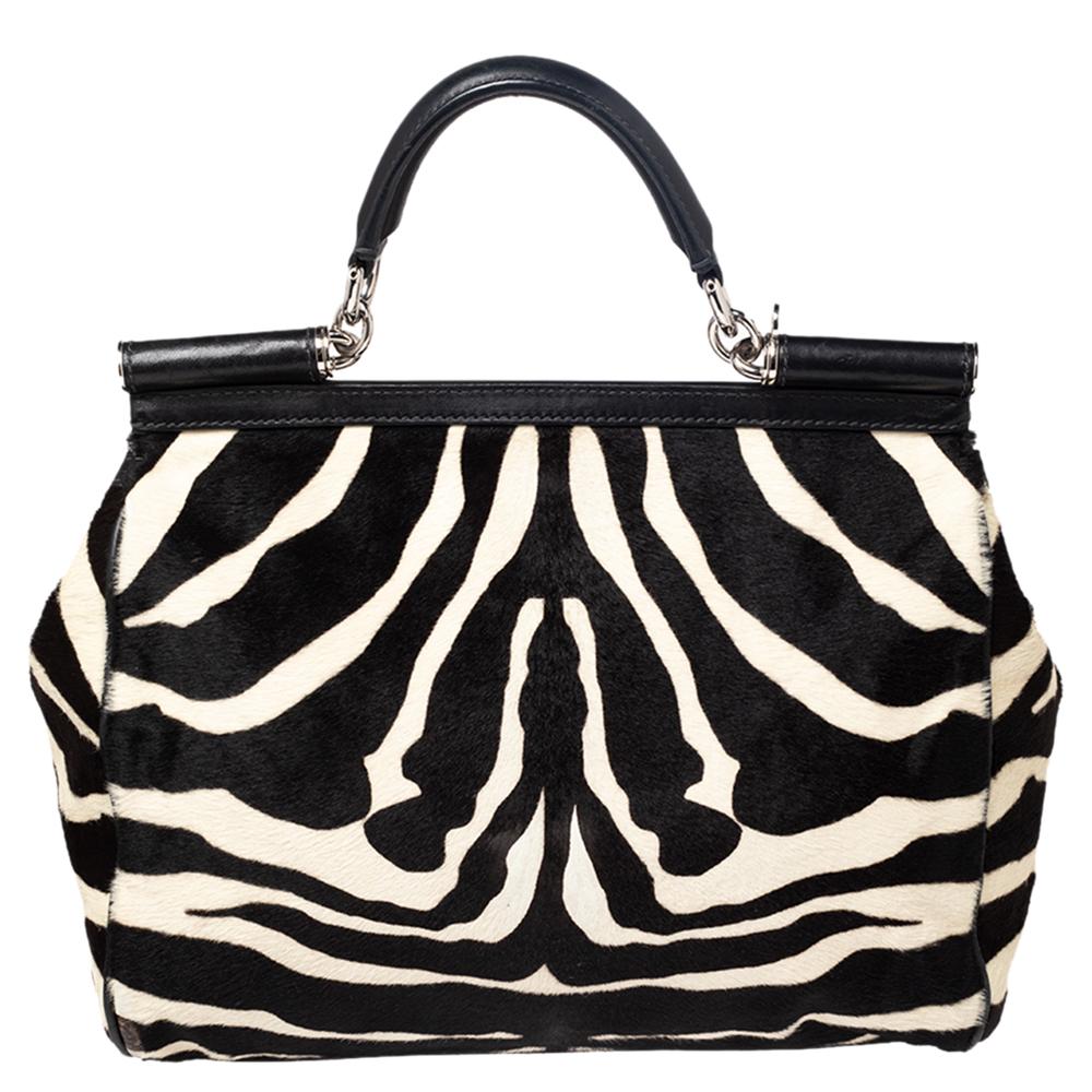 One of the most coveted creations of the House is this Miss Sicily bag from Dolce & Gabbana. This bag epitomizes feminine style and charm with its shapely silhouette, elegant style, and classy exterior. It is crafted using brown-black zebra-print