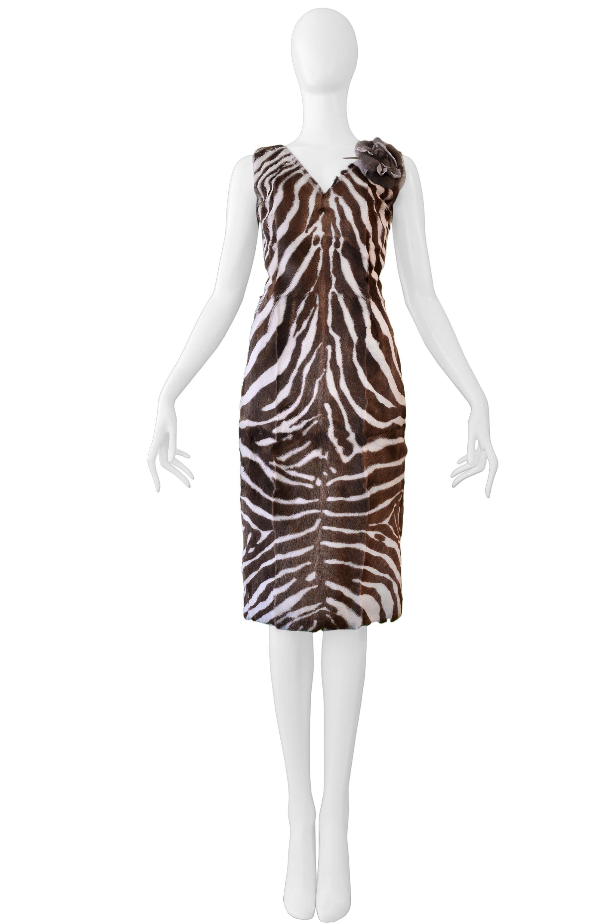 Resurrection Vintage is excited to offer a vintage Dolce & Gabbana brown and off-white zebra-print pony hair dress featuring and v front and back neckline, decorative flower, black bra elastic strap closure, and center back zipper.

Dolce &
