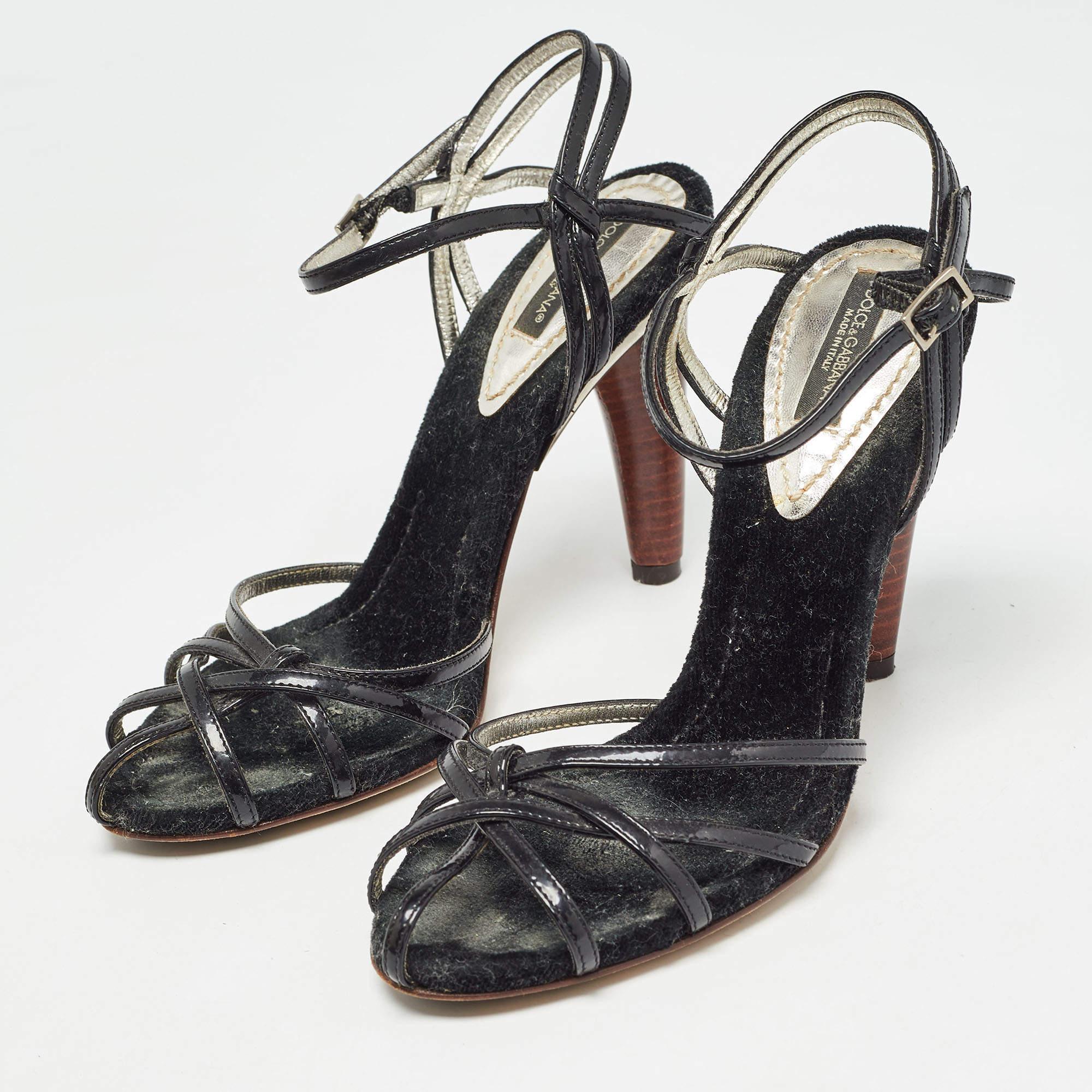 A gorgeous pair of sandals from the house of Dolce and Gabbana to highlight your fabulous styling choices. Crafted from black patent leather they have a strappy exterior ankle buckle closure and 10 cm heels.

