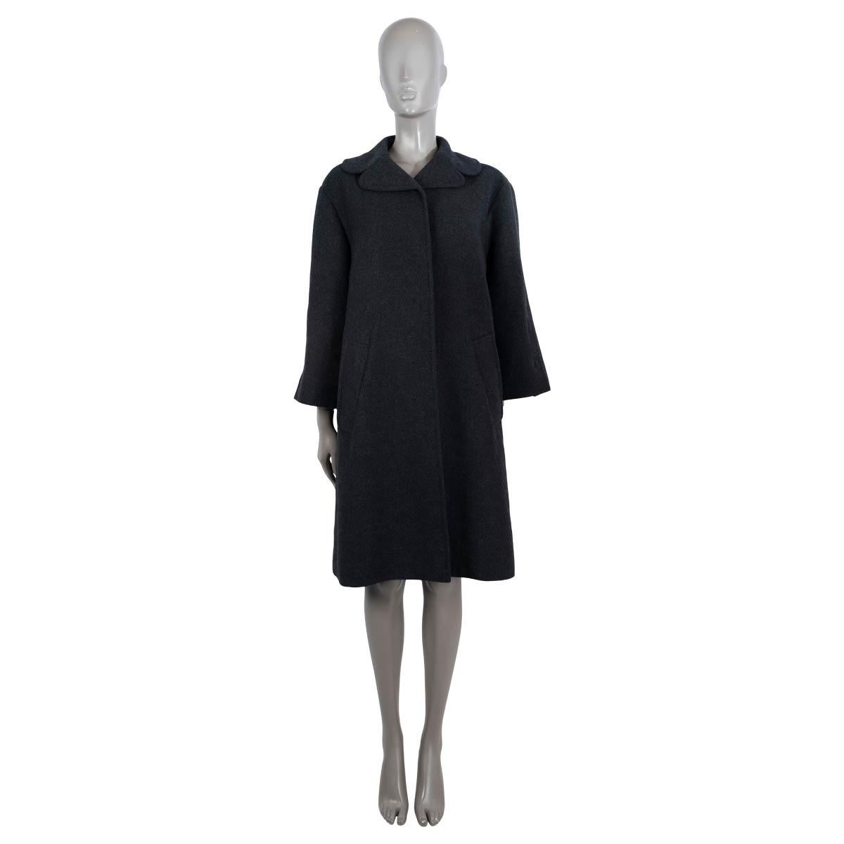 100% authentic Dolce & Gabbana coat in dark grey cashmere (100%). Features rounded notch lapels and two slant pockets at the waist. Opens with concealed buttons. Unlined. Has been worn and is in excellent condition.

Measurements
Tag