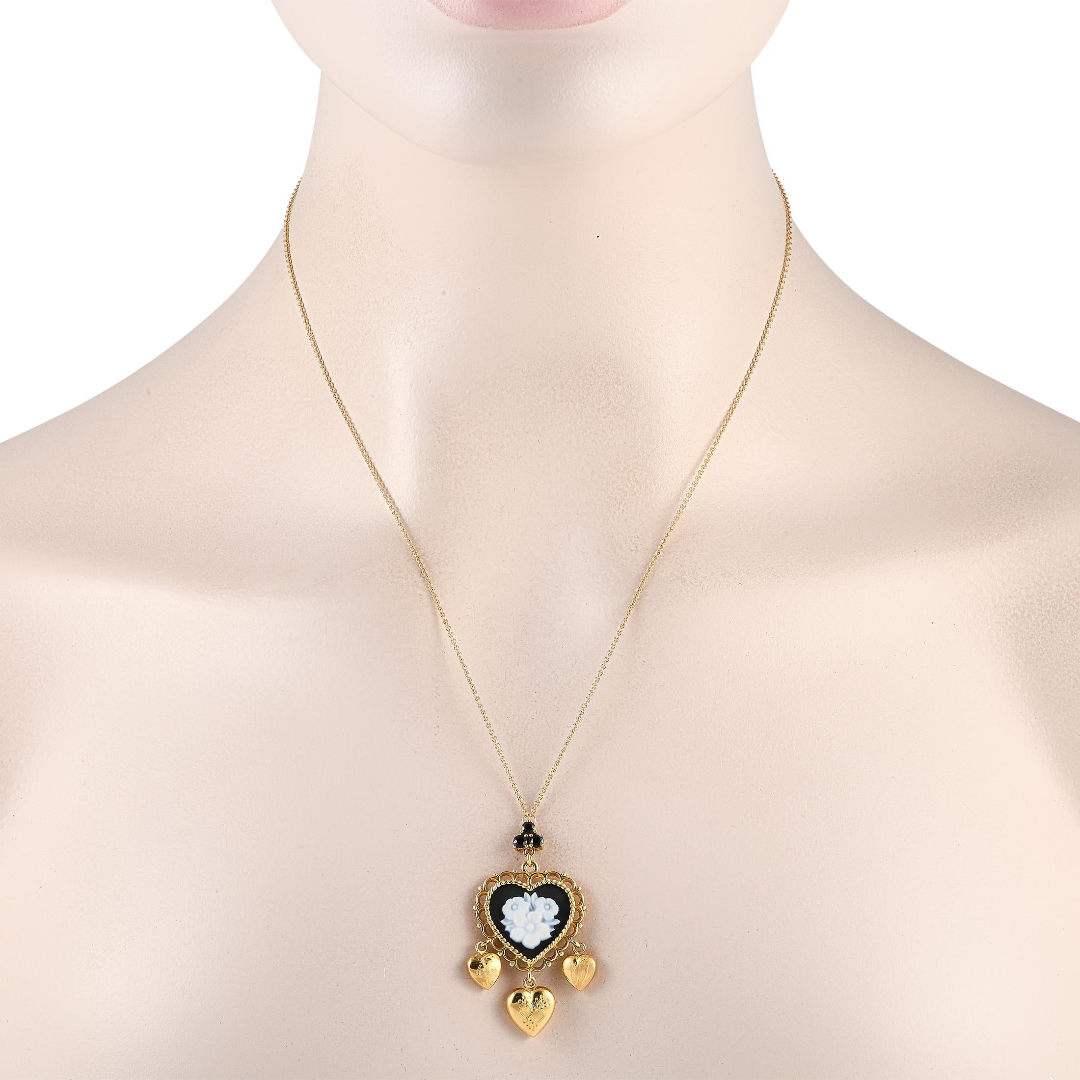This breathtaking Dolce and Gabbana necklace is an elevated piece that exudes old world elegance. The 18K Yellow Gold heart-shaped pendant  which measures 1.75 long by 1.0 wide  comes to life thanks to ornate metalwork, floral motifs, Black Jade
