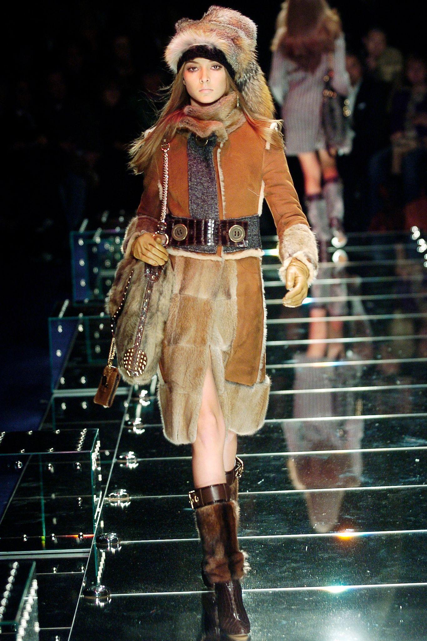 Designed by Stefano Dolce and Domenico Gabbana
Sold by Skof.Archive
Autumn-Winter 2005 Collection
Runway Look 60
Brown Fur and Leather Coat 
High Buttoned Neck
Lambskin Fur Applications
Alligator Leather Belt
Made n Italy 
Excellent