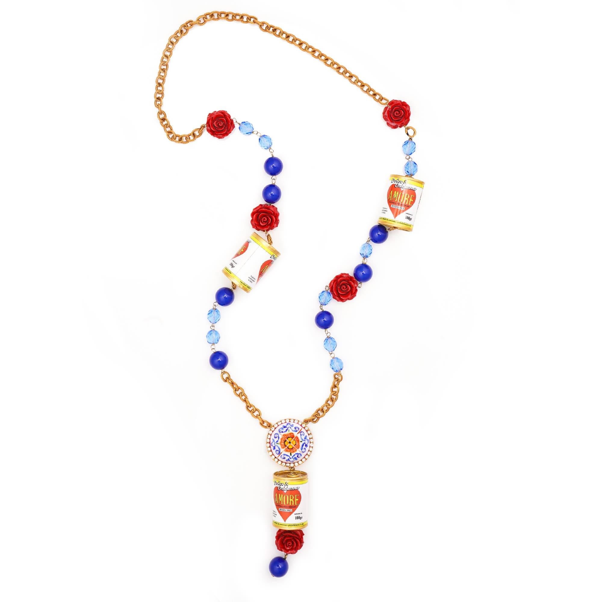 - Amore Heart Can Chain necklace with roses and crystals in gold, blue and red by DOLCE & GABBANA
- RUNWAY - Dolce & Gabbana Fashion Show
- New with Box
- Made in Italy
- Nickel free
- Model: WNK6M4-W1111-Z0000
- Material:  50% Resin, 30% Messing,