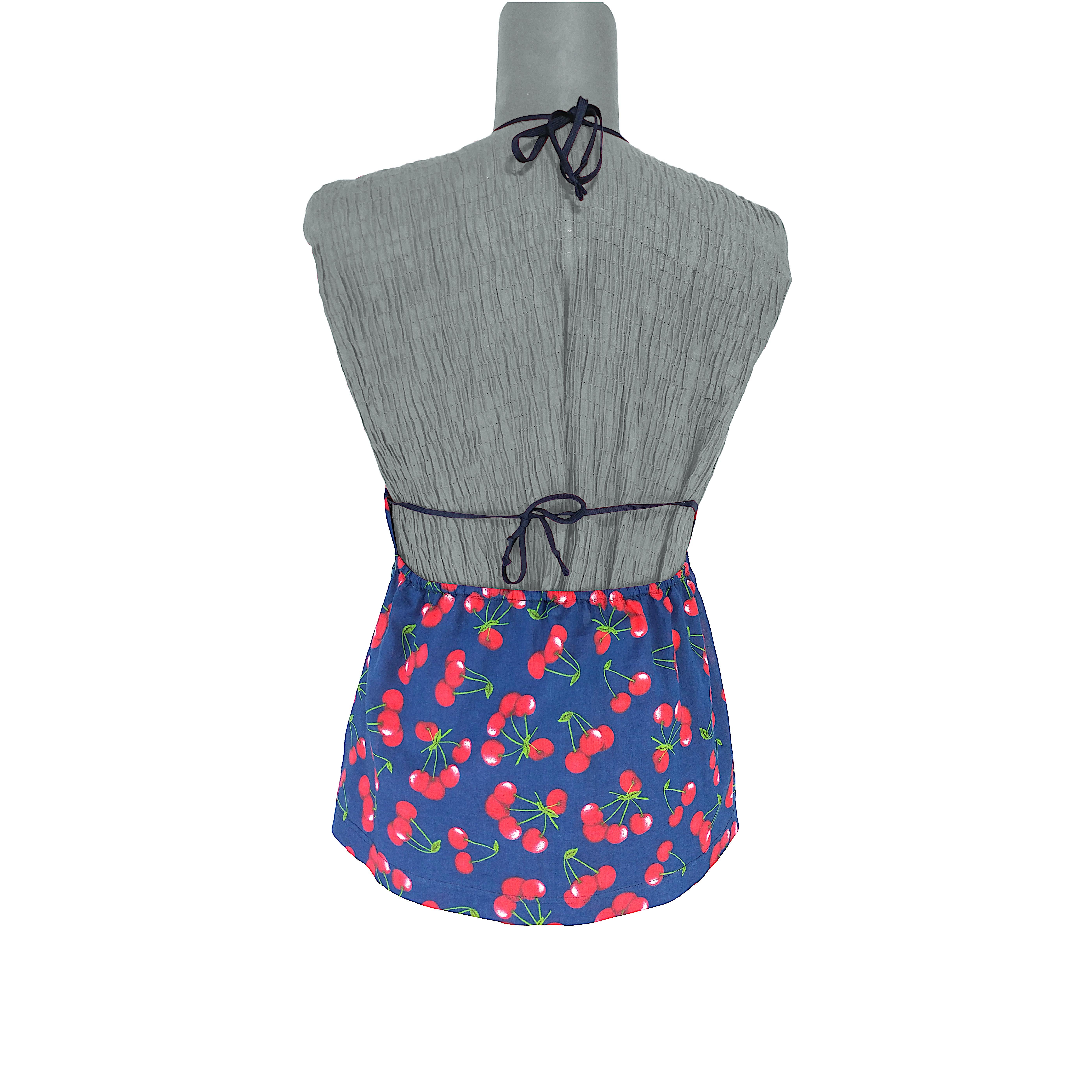A tank top in pure blue cotton printed with an iconic handful of red cherries which has been used several times by the popular Italian designers duo. The top features a scoop neckline and a double string closure, one in the back and one on the neck.
