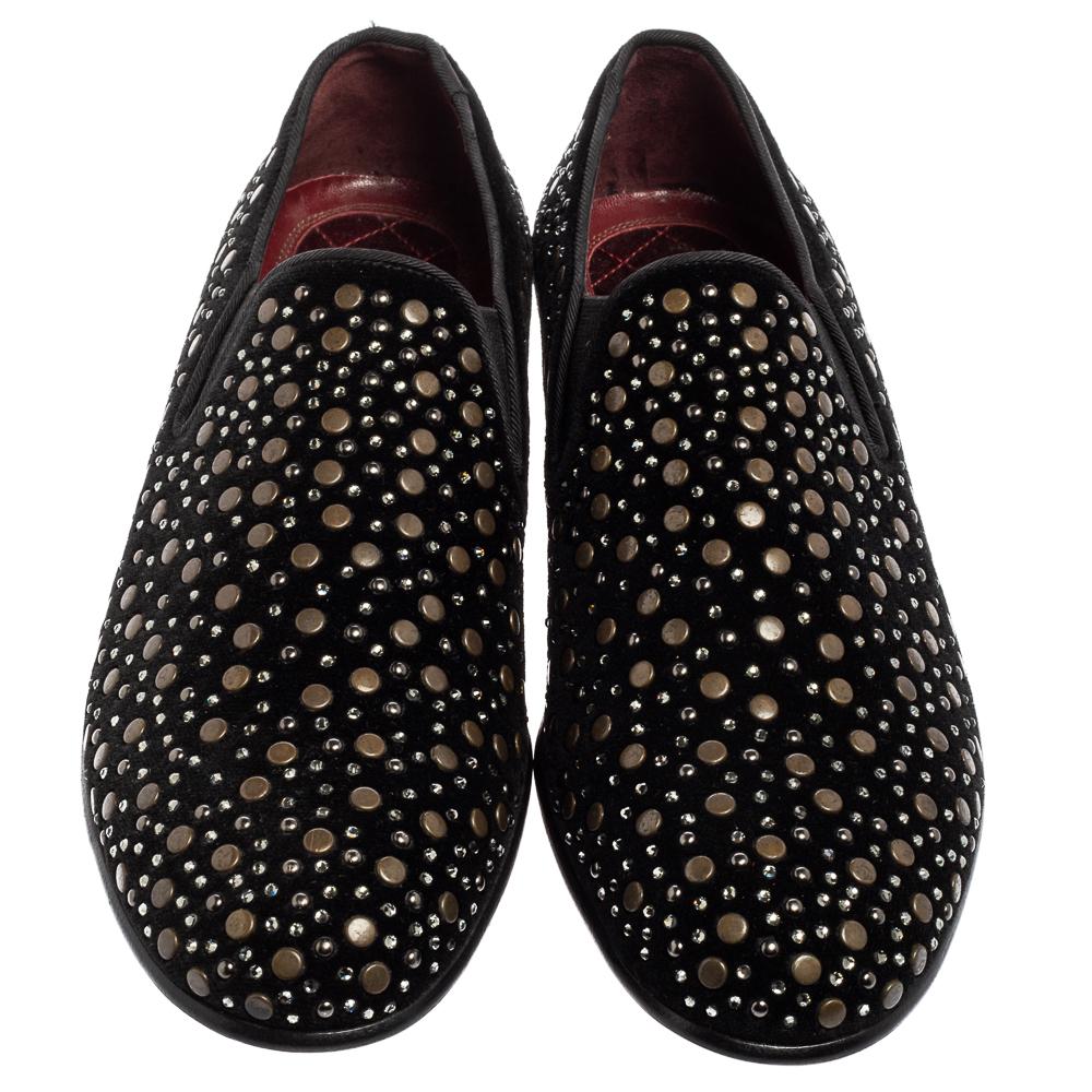 Add a bit of jazz to those muted outfits of yours with these glamorous loafers from the house of Dolce&Gabbana. Embodying the spirit of the label in the truest form, these black suede shoes are punctuated with gold-tone studs and crystals all over,