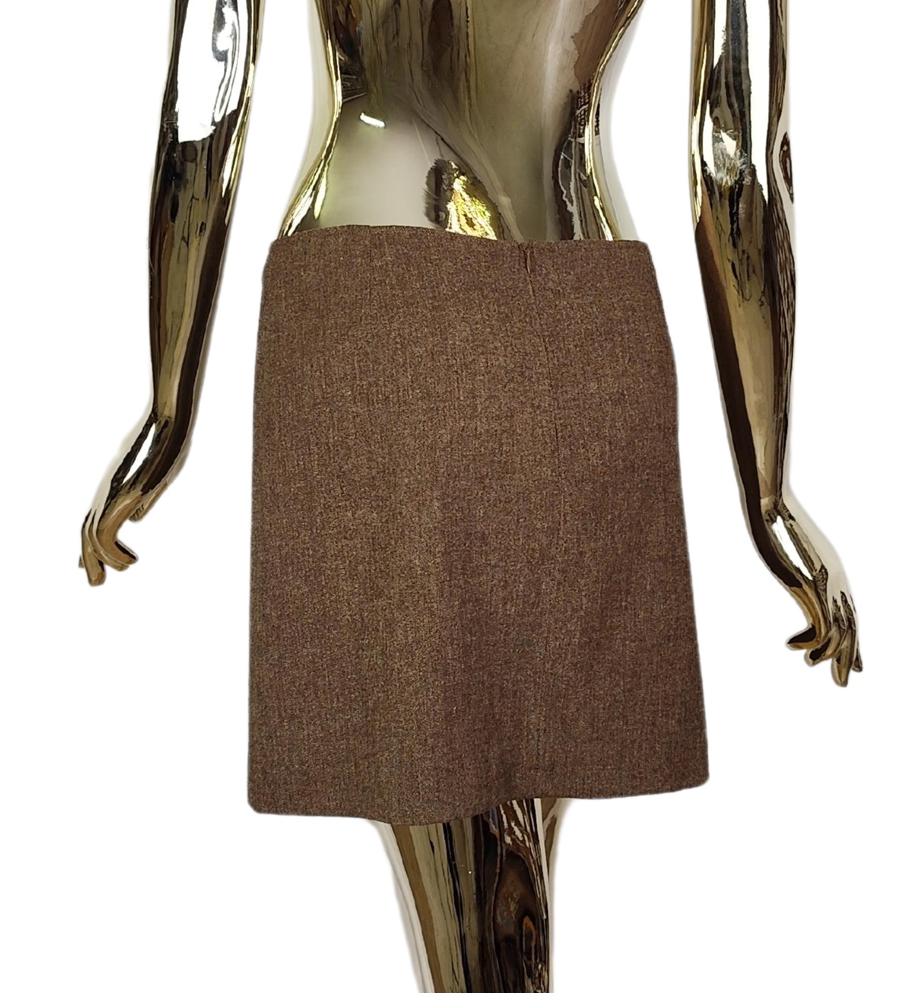 Minigonna Dolce & Gabbana
Lana marrone melange
Foderato

Taglia 40 IT

Misure:
vita 80 cm - 31 in
fianchi fino a 106 cm - fino a 43 pollici (con un po' di elasticità) 
lunghezza 37 cm

Nuovo con tag