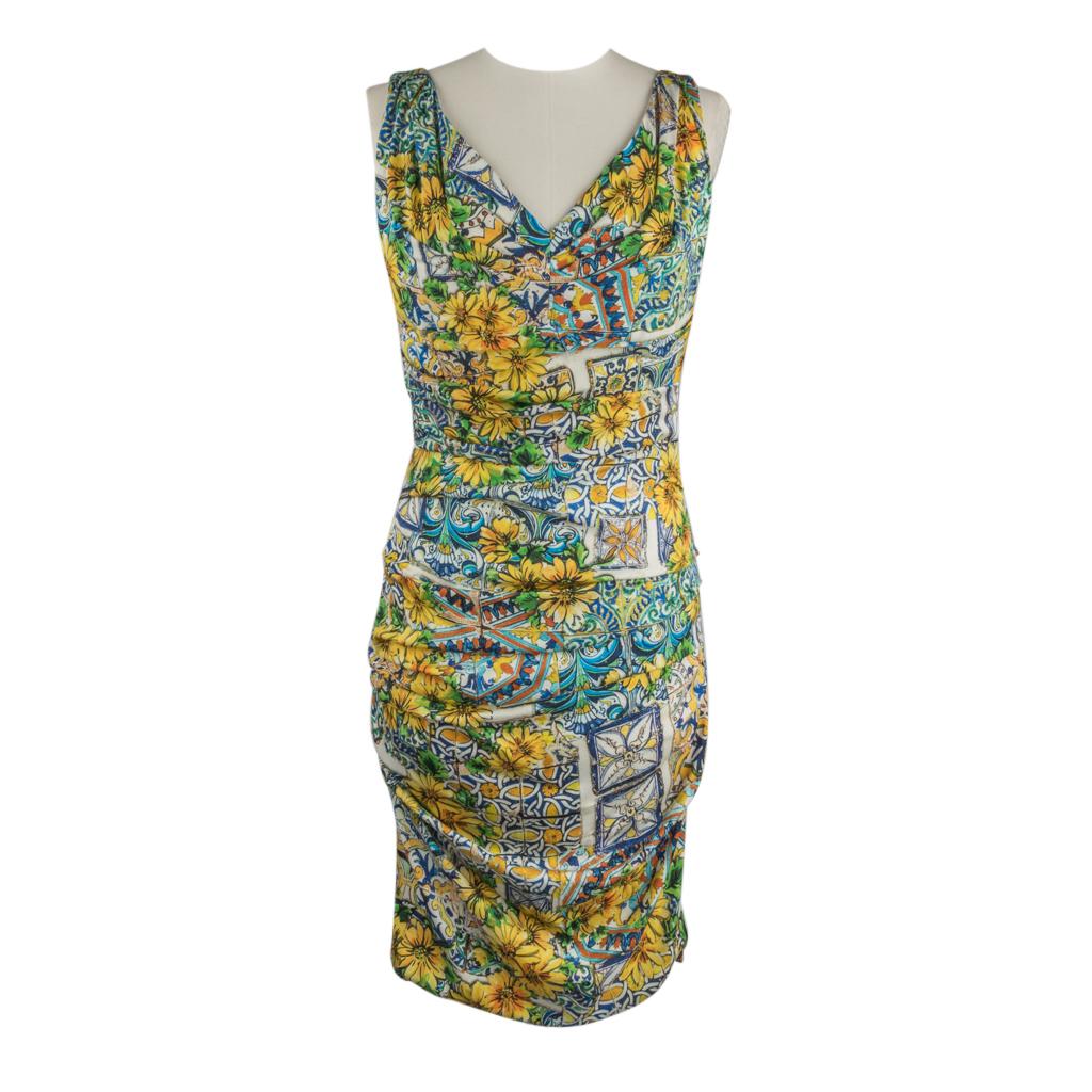 Guaranteed authentic Dolce & Gabbana charming majolica print dress.
Sleeveless with V-neck.
The beautiful majolica print in shades of yellow, gold, blues, greens with hints of sienna.
Dress has gentle rouching throughout and is fully lined. 
Fabric