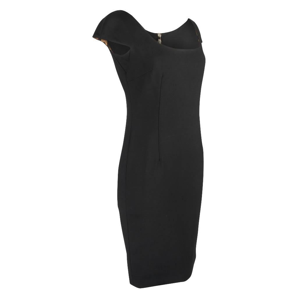 Guaranteed authentic Dolce & Gabbana classic signature black dress.
Always the most perfect cut which is simple, clean and elegant.
Sleeveless scoop neck with a small cap sleeve finish.
Bold rear zipper with double toggle that you can wear closed or