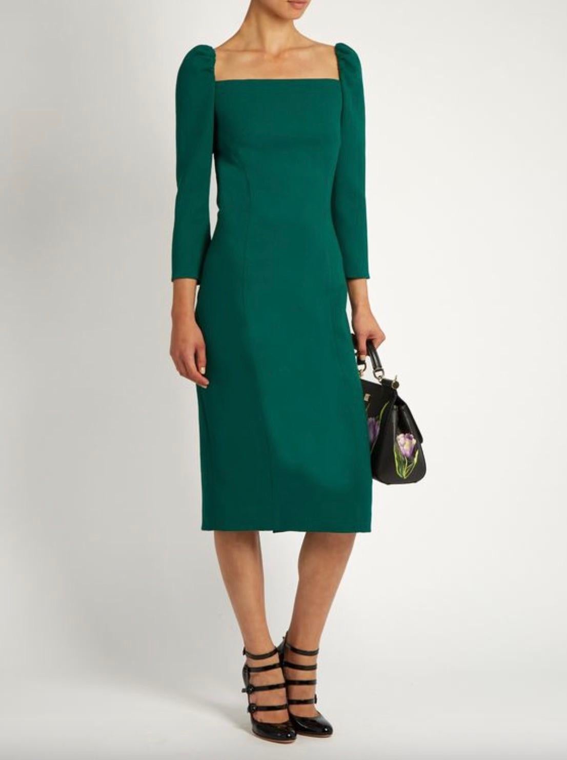 This emerald-green stretch wool-crepe dress by Dolce&Gabbana is a stunning example designed with lightly ruched shoulders and exposed seams to sculpt the most feminine silhouette. Fully lined in silk. 
In excellent condition with no flaws to note.