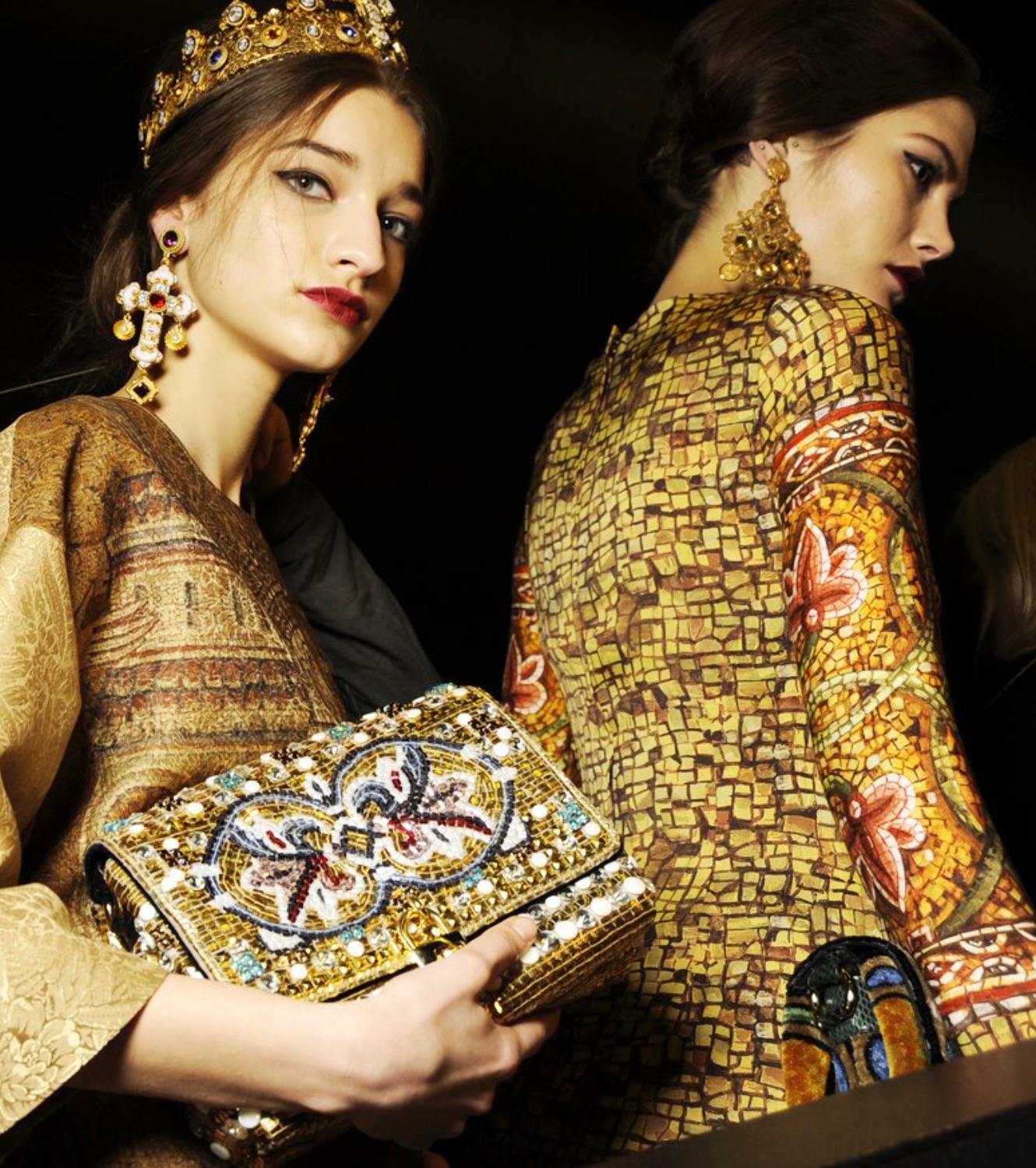 The Dolce&Gabbana Fall/Winter 2013 Byzantine mosaic shoulder bag is a stunning piece from the iconic collection inspired by the mesmerizing mosaics of the Monreale Cathedral in Sicily. This exquisite bag features a genuine python leather handle and