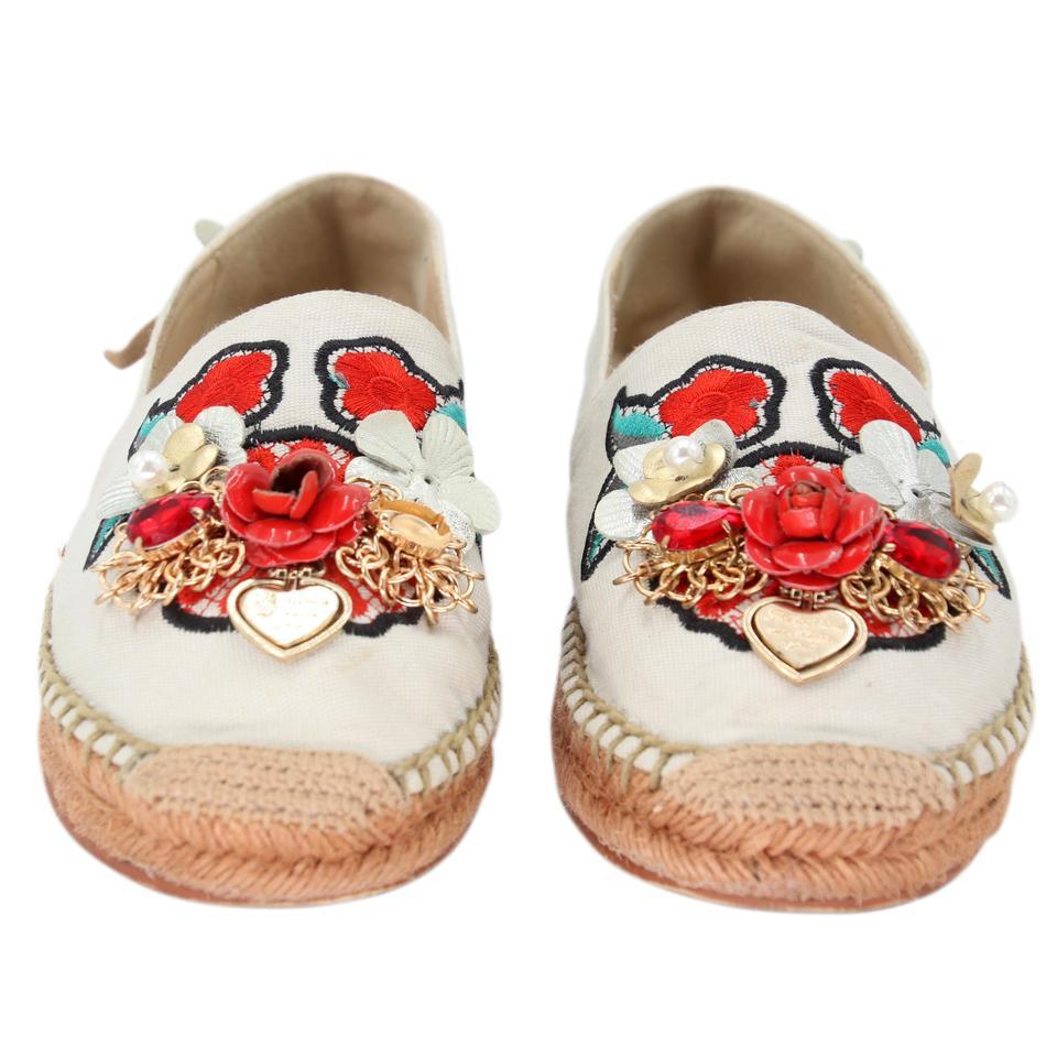 Dolce&Gabbana Pearl Espadrille 39 Floral Embellished Fabric Flats DG-0525N-0218

These adorable espadrille flats are so fun! Featuring ivory leather embellished with flowers and jewels. Casual espadrille soles are always a hit in the warmer months.