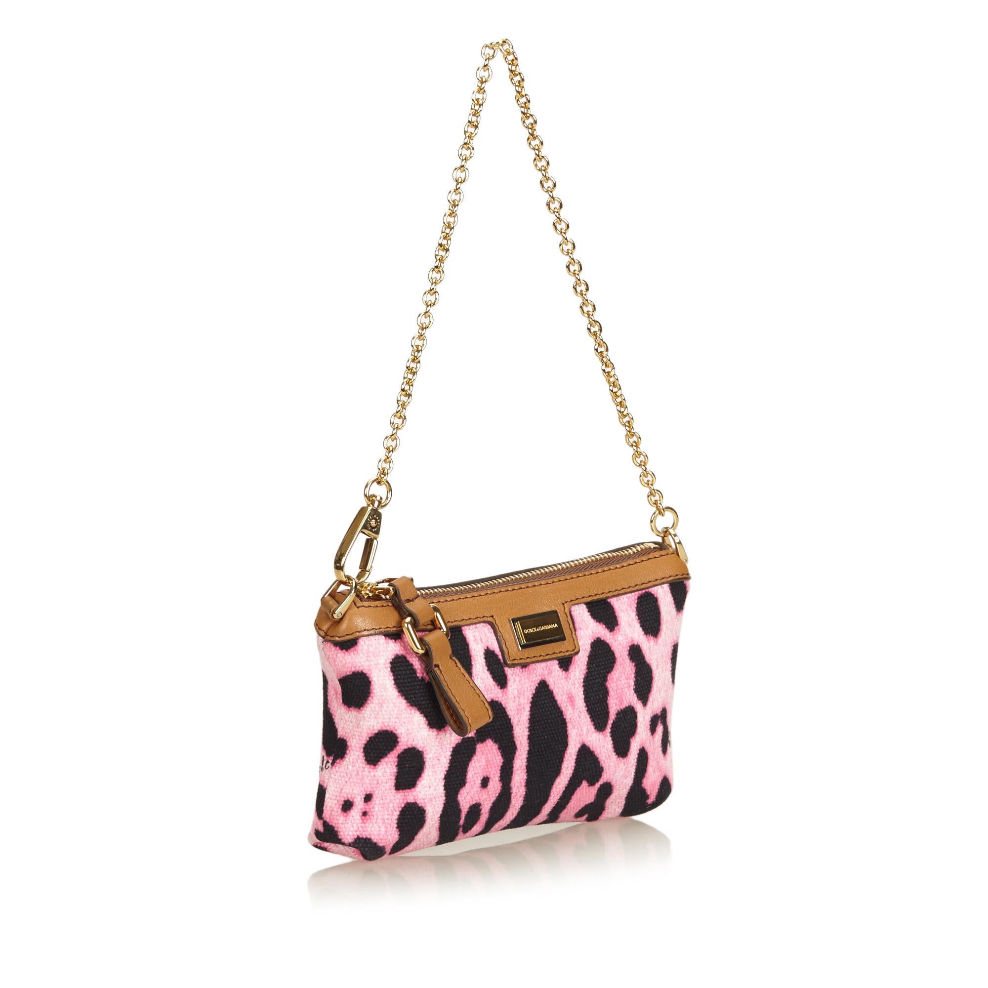 This baguette features a leopard printed canvas body, detachable gold-tone chain strap, and a top zip closure. It carries as AB condition rating.

Inclusions: 
This item does not come with inclusions.

Dimensions:
Length: 10.00 cm
Width: 15.00