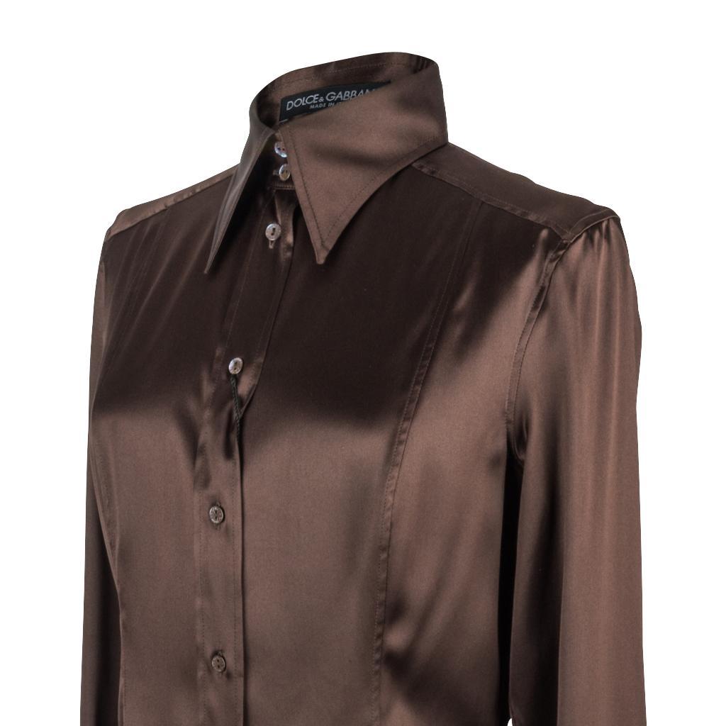Guaranteed authentic Dolce&Gabbana beautifully shaped brown silk button down shirt.
Deep chocolate brown silk shirt with stretch and fabulous shaping.
Logo embossed buttons down front of shirt and on cuffs.
Rear has shaped detail. 
Classic