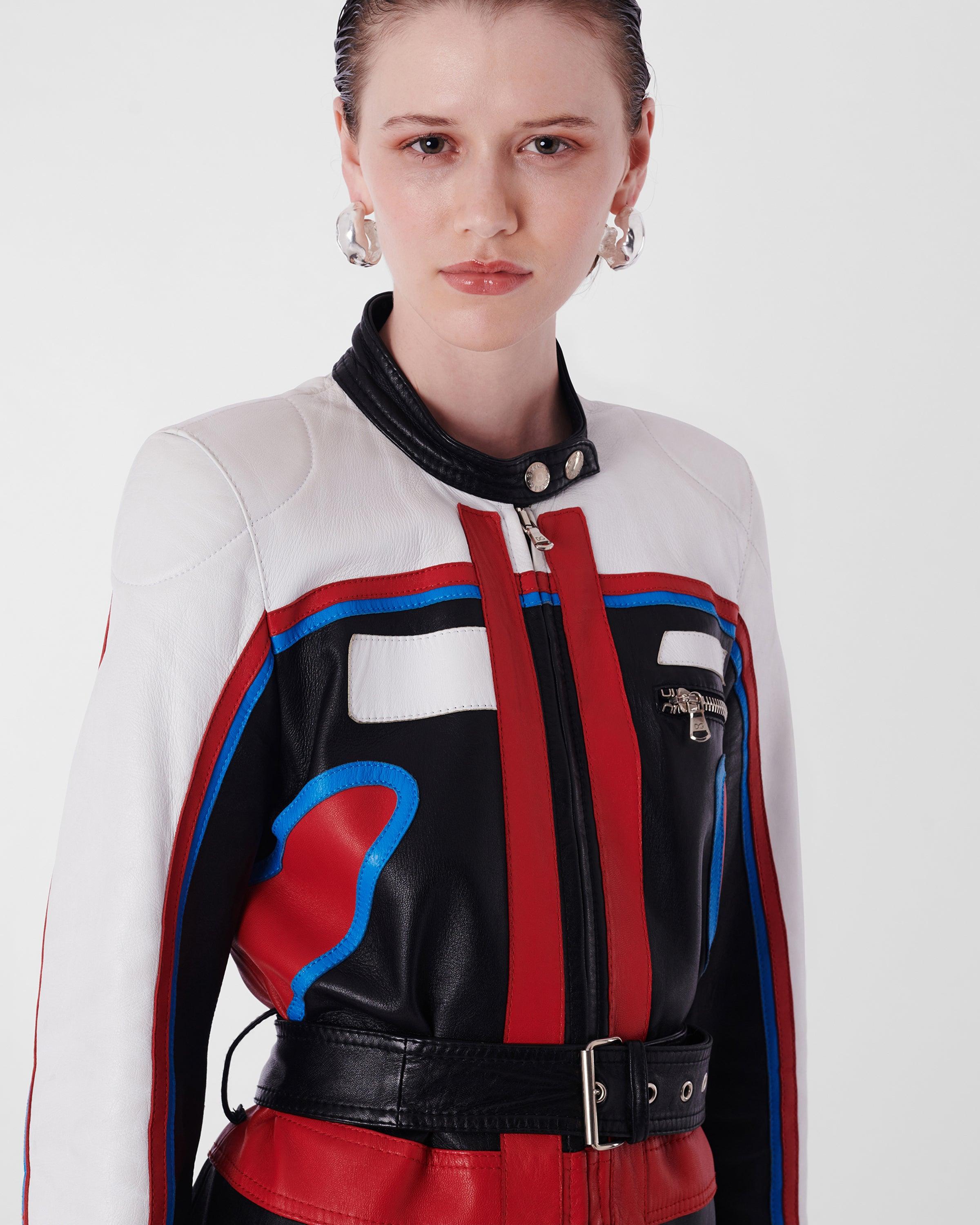 Dolce & Gabbana S/S 2001 Runway Biker Jacket. Features front zip pocket, shoulder pads, elbows pads, waist belt and knee length with front zip fastening. In excellent vintage condition. Please note the belt is not the original. 

Brand: Dolce &