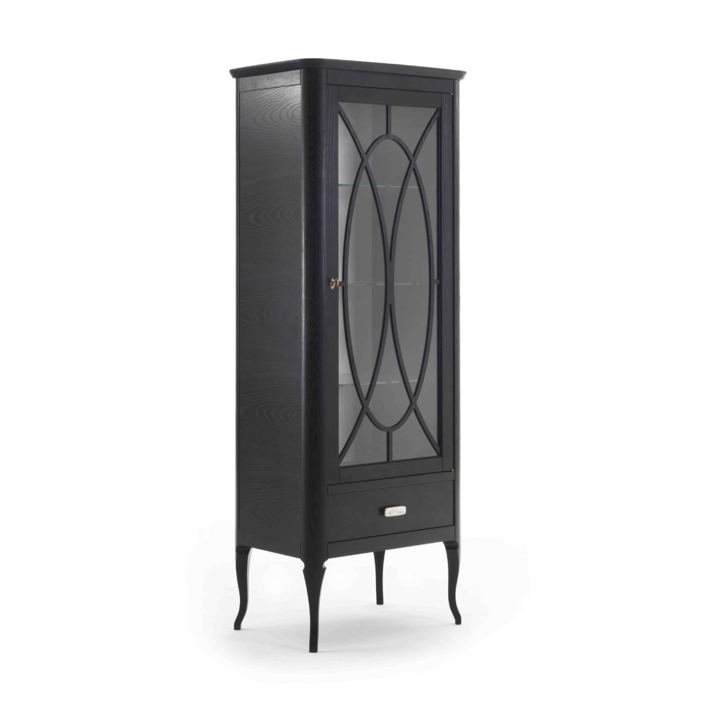 Simple yet sophisticated, this display cabinet will become the focal point in a living or dining room of a modern interior. Both elegant and functional, the wooden ash-veneered frame with an ebonized finish is raised on slender, cabriole-style legs