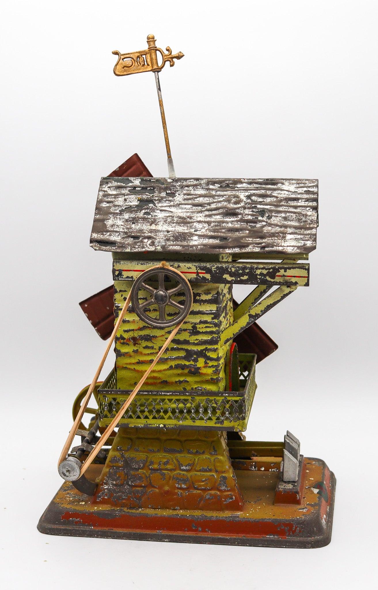 DOLL & Co. 1900 Alemania Manivela Molino de viento Martillo Máquina de vapor Juguete de hojalata Estaño en venta