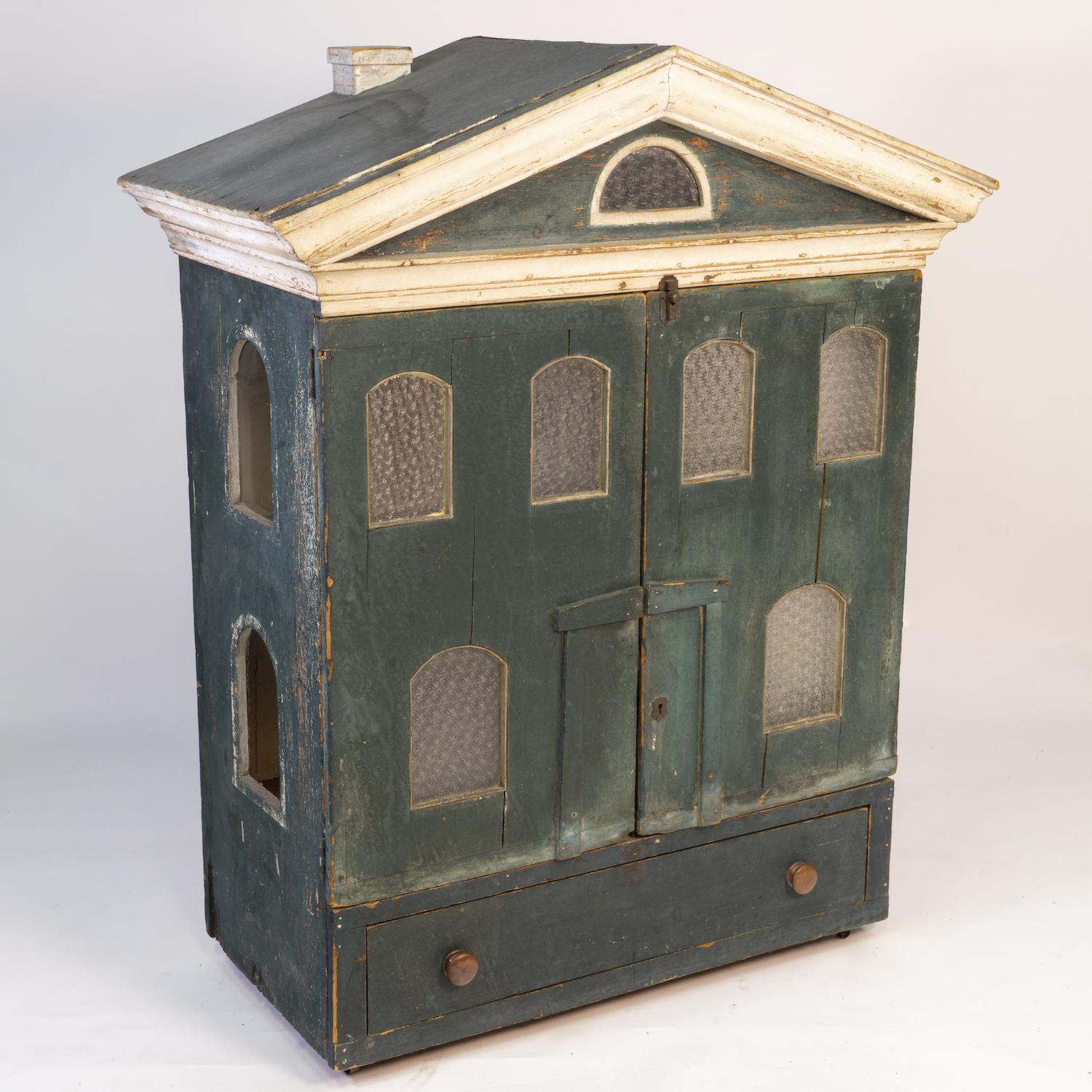 Doll house cabinet, 19th century. Painted pine Greek revival doll house cabinet with four room cubbys and lower drawer. Cabinet is on four casters.
   